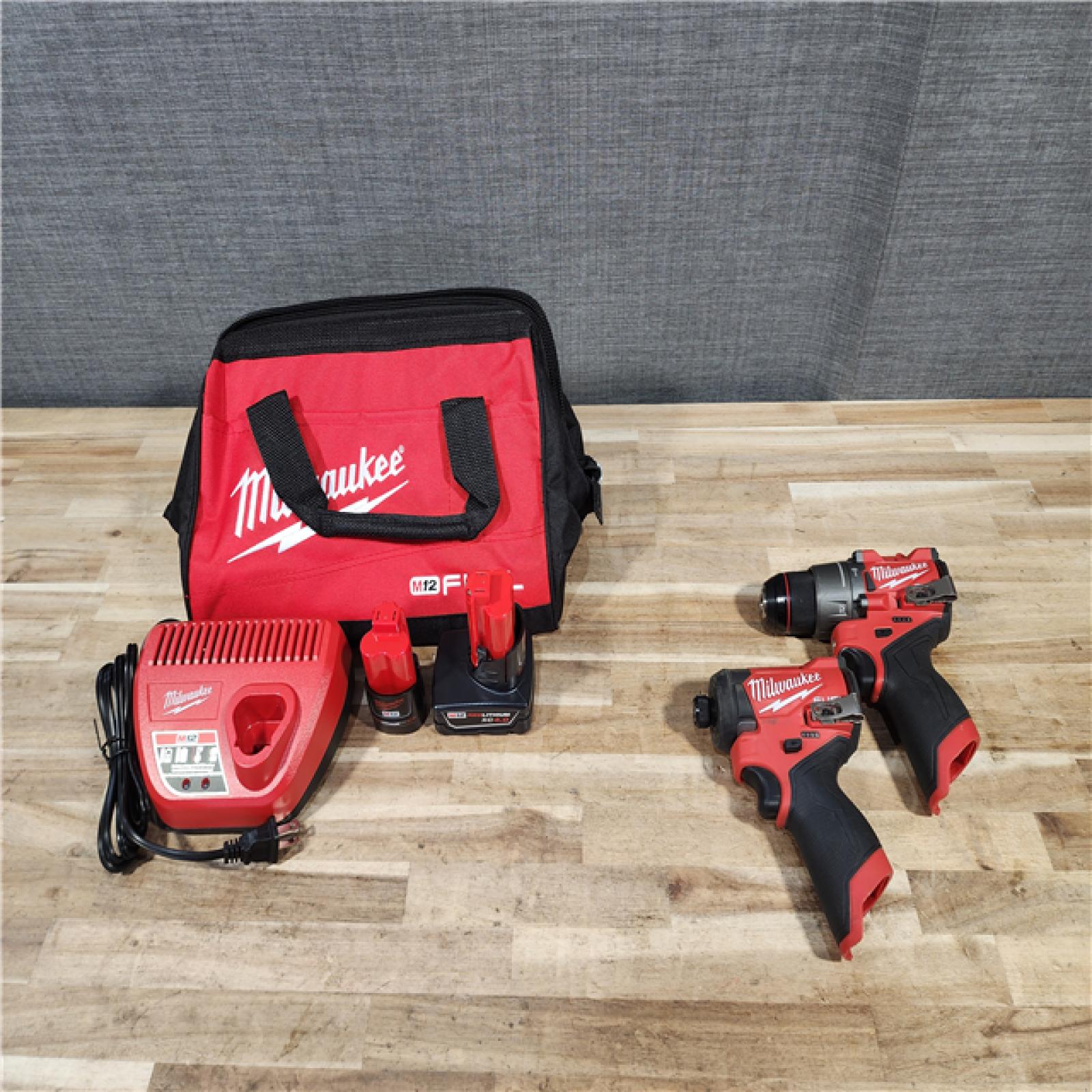 HOUSTON LOCATION - AS-IS Milwaukee  FUEL 12-Volt Lithium-Ion Brushless Cordless Hammer Drill and Impact Driver Combo Kit