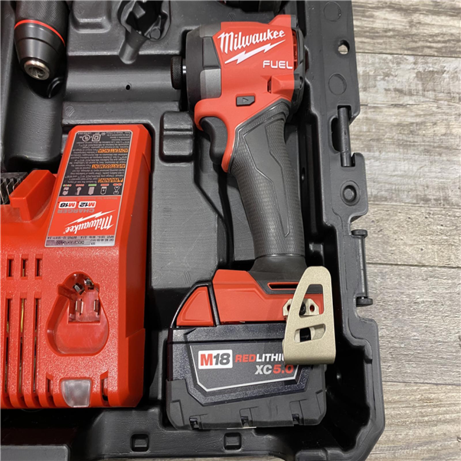 AS-IS Milwaukee FUEL 18V Lithium-Ion Brushless Cordless Hammer Drill and Impact Driver Combo Kit