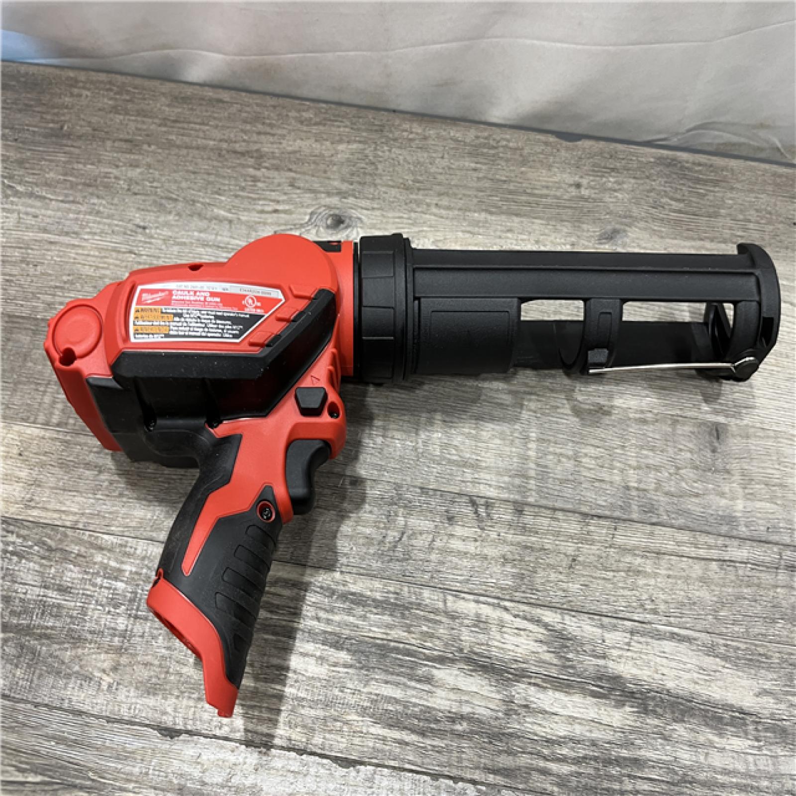 AS-IS Milwaukee 12V Lithium-Ion Cordless 10 oz. Adhesive and Caulk Gun (Tool-Only)