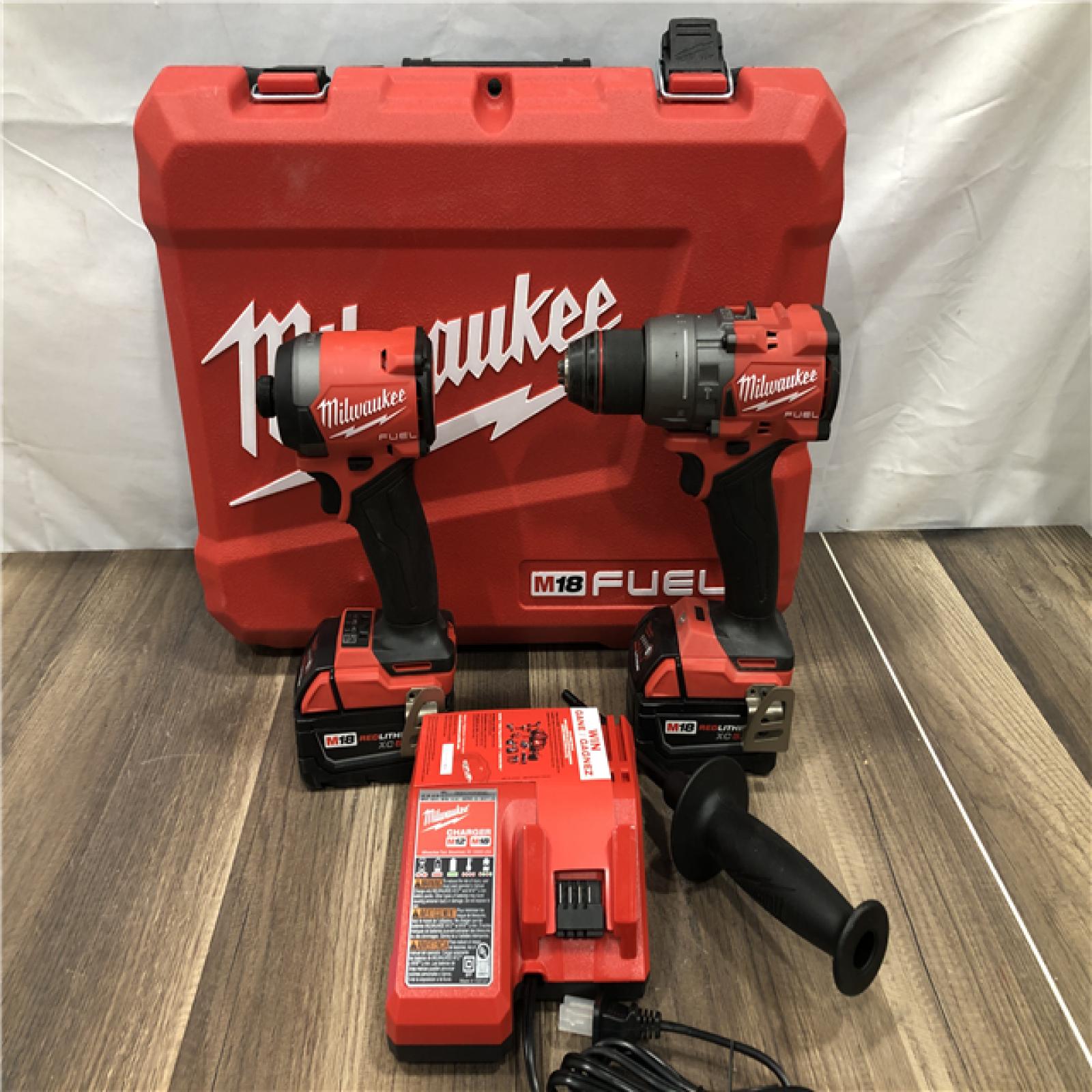 AS-IS Milwaukee FUEL 18V Lithium-Ion Brushless Cordless Hammer Drill and Impact Driver Combo Kit