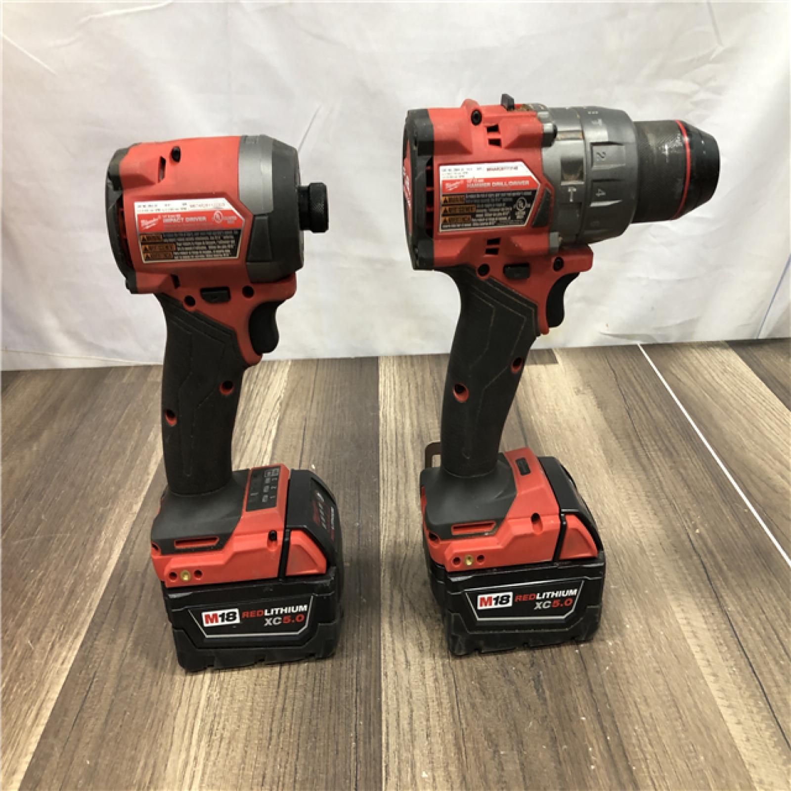 AS-IS Milwaukee FUEL 18V Lithium-Ion Brushless Cordless Hammer Drill and Impact Driver Combo Kit