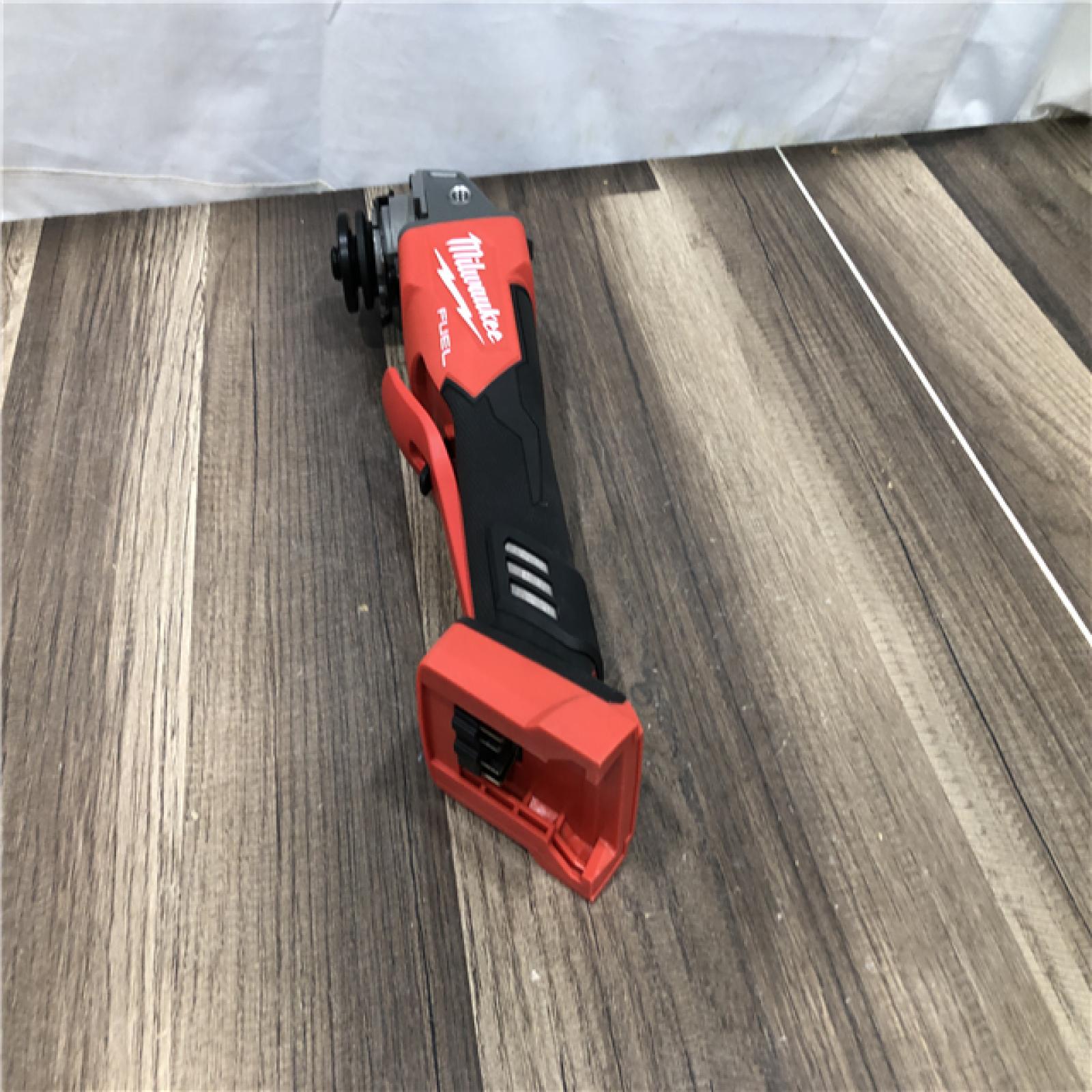 AS-IS Milwaukee FUEL 18V Lithium-Ion Brushless Cordless 4-1/2 in./5 in. Grinder with Variable Speed & Paddle Switch (Tool-Only)