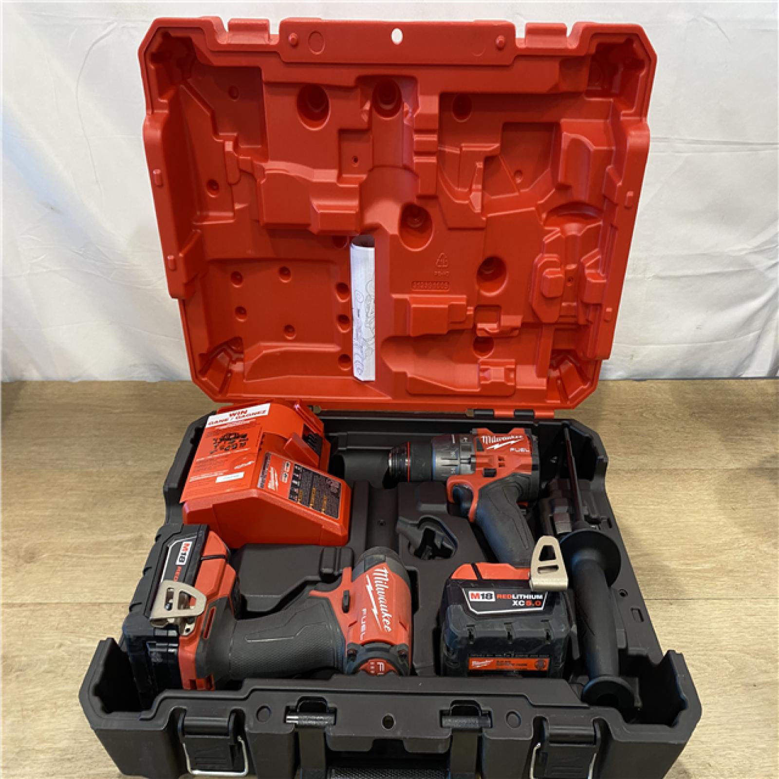 AS-IS Milwaukee FUEL 18V Lithium-Ion Brushless Cordless Hammer Drill and Impact Driver Combo Kit