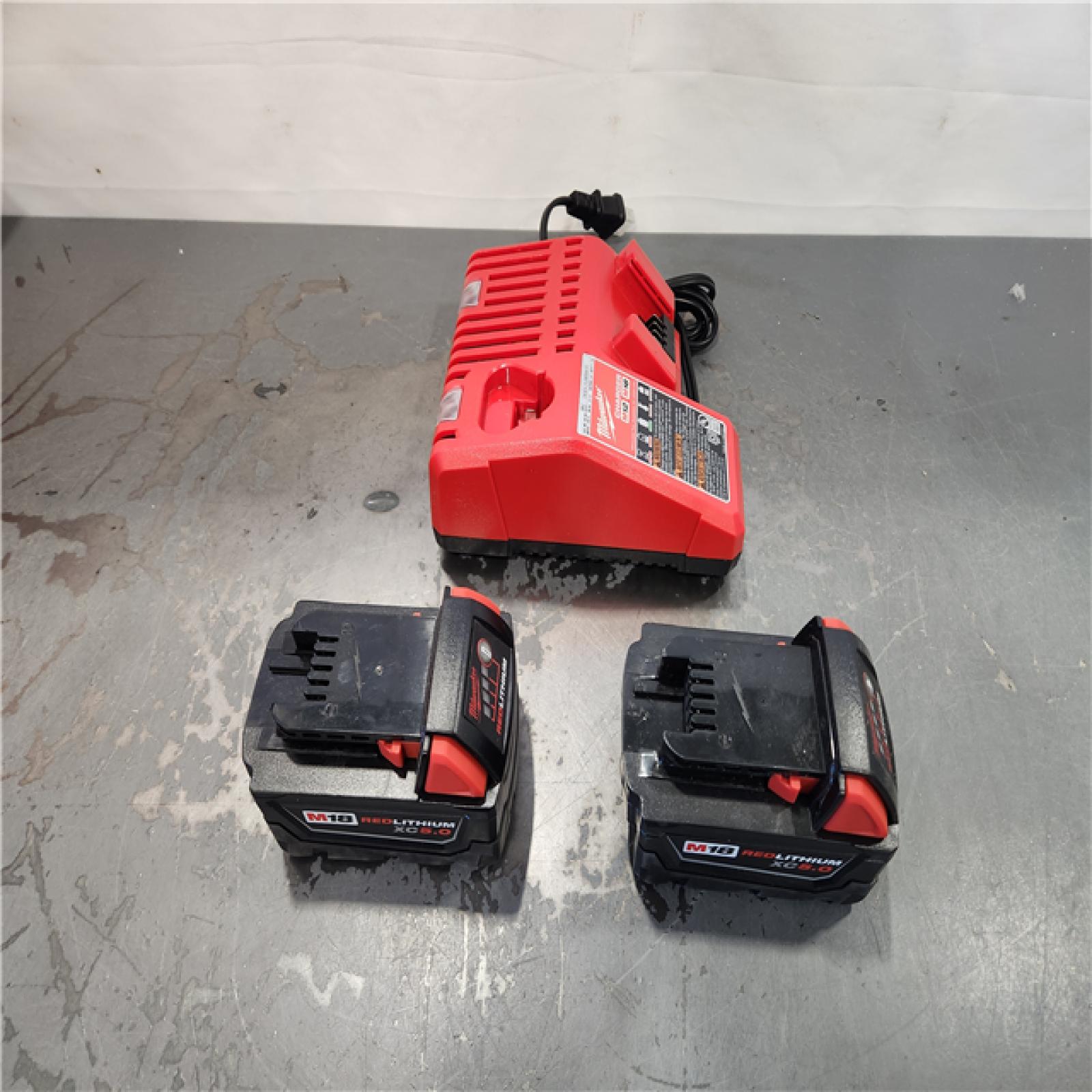 AS-IS- Milwaukee M18 18-Volt Lithium-Ion XC Starter Kit with Two 5.0Ah Batteries and Charger