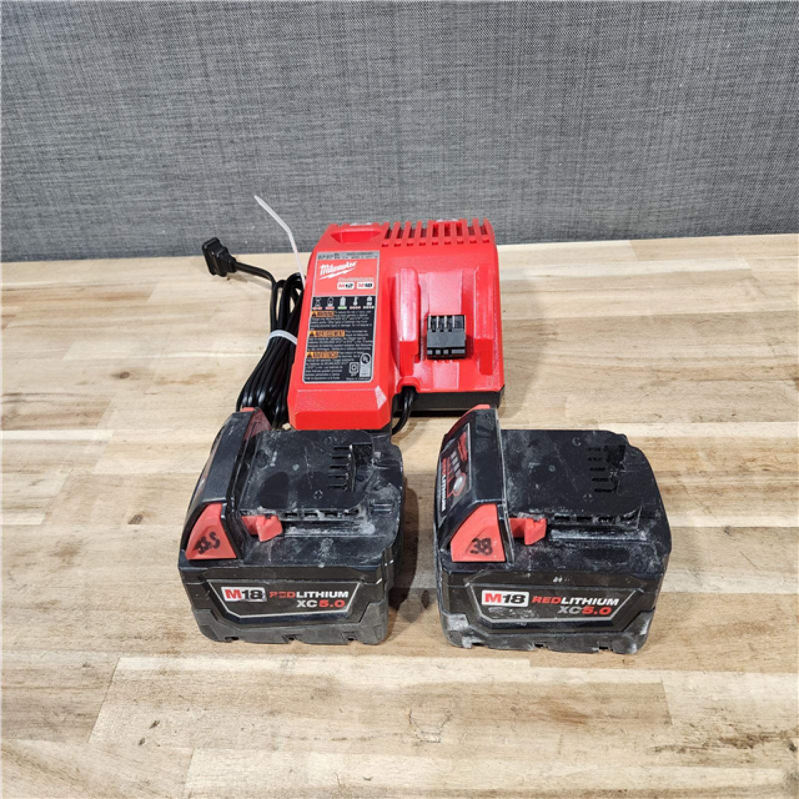 HOUSTON LOCATION - AS-IS MILWAUKEE 2 TOOL COMBO KIT W/ (2) BATTERY & CHARGER