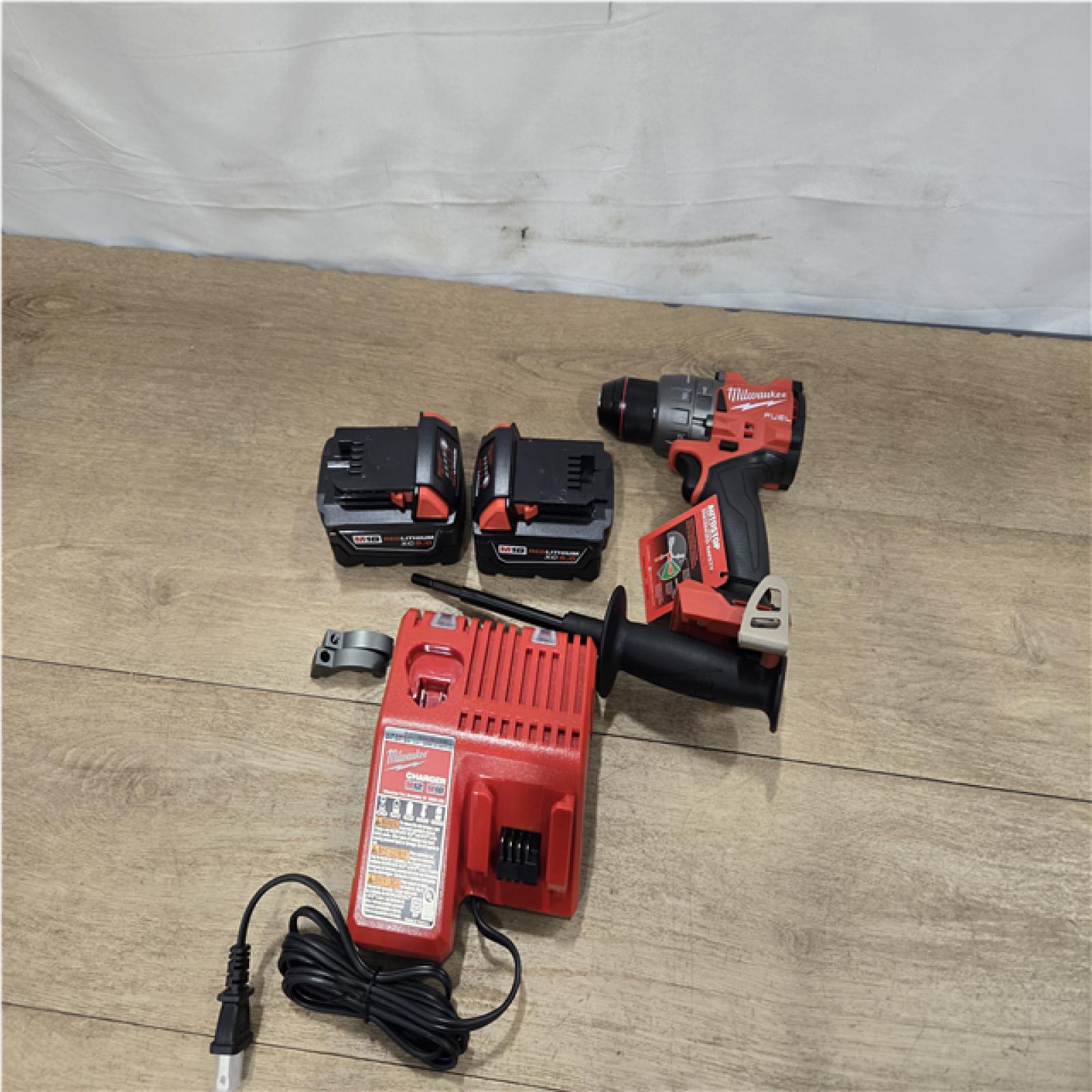 AS-IS Milwaukee FUEL 18V Lithium-Ion Brushless Cordless 1/2 in. Hammer Drill Driver Kit