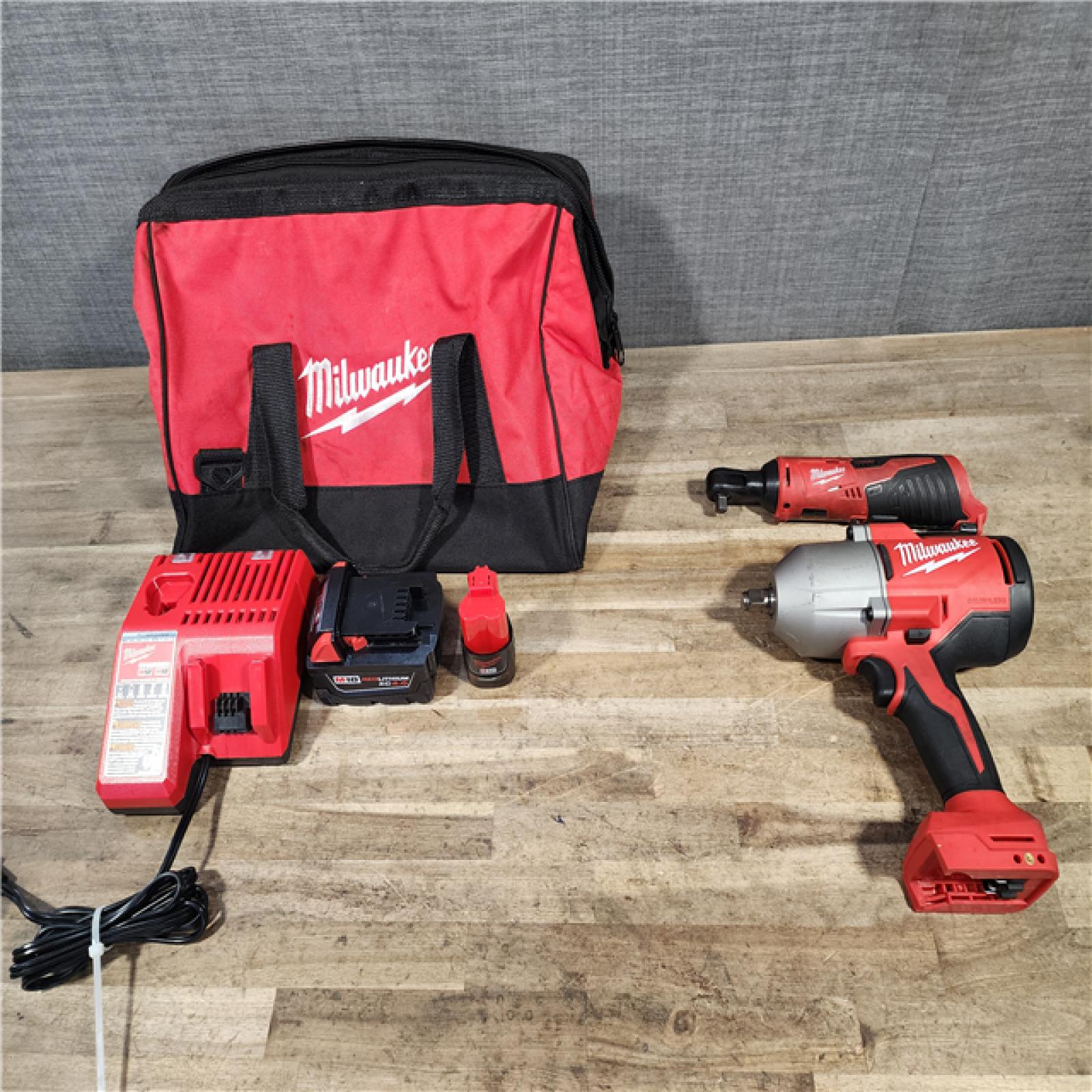 HOUSTON LOCATION - AS-IS Milwaukee 12/18V Lithium-Ion Cordless 3/8 in. Ratchet and 1/2 in. High Torque Impact Wrench with Friction Ring Combo Kit