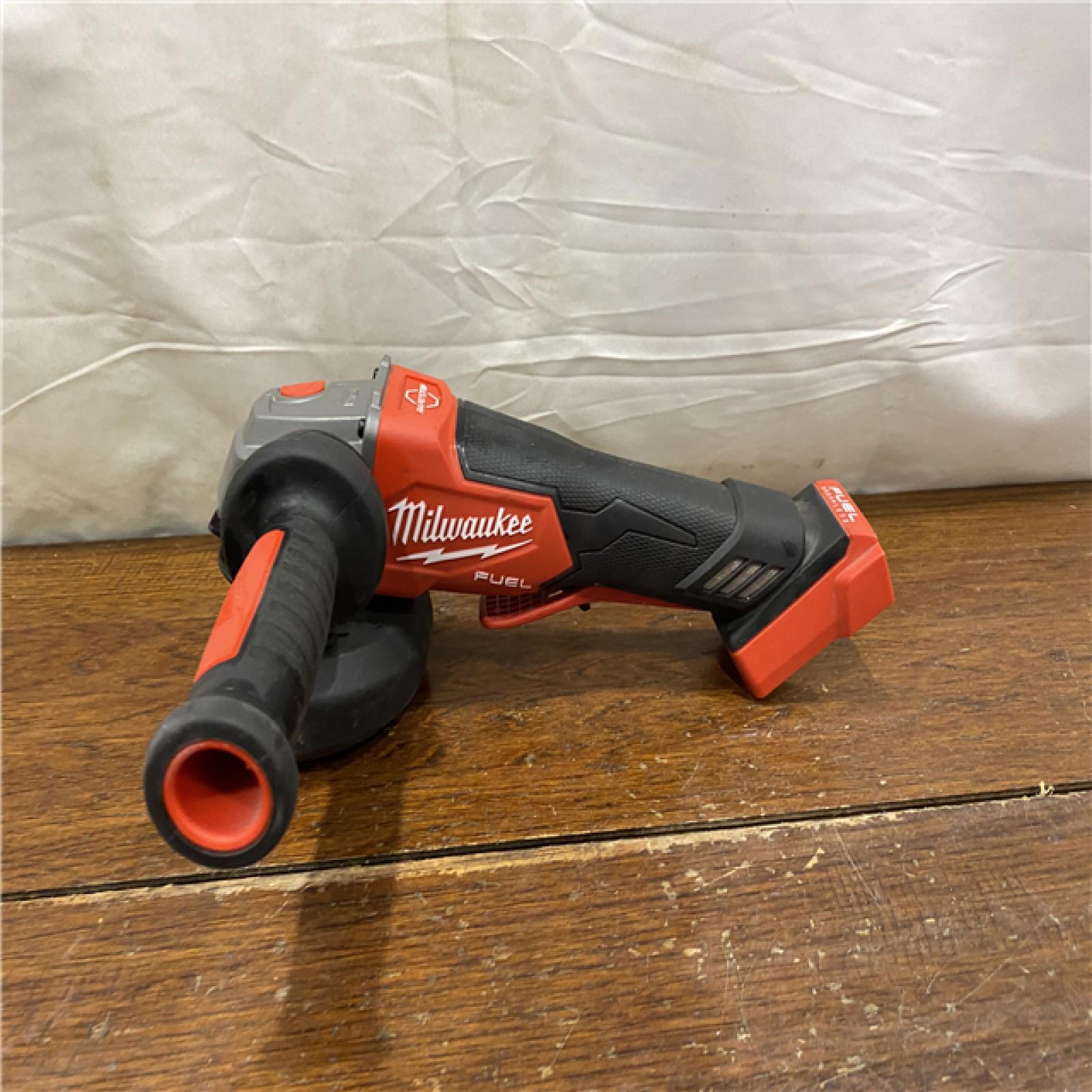 AS-IS Milwaukee 2880-20 M18 FUEL 18-Volt Lithium-Ion Brushless Cordless 4-1/2 in./5 in. Grinder W/Paddle Switch (Tool-Only)
