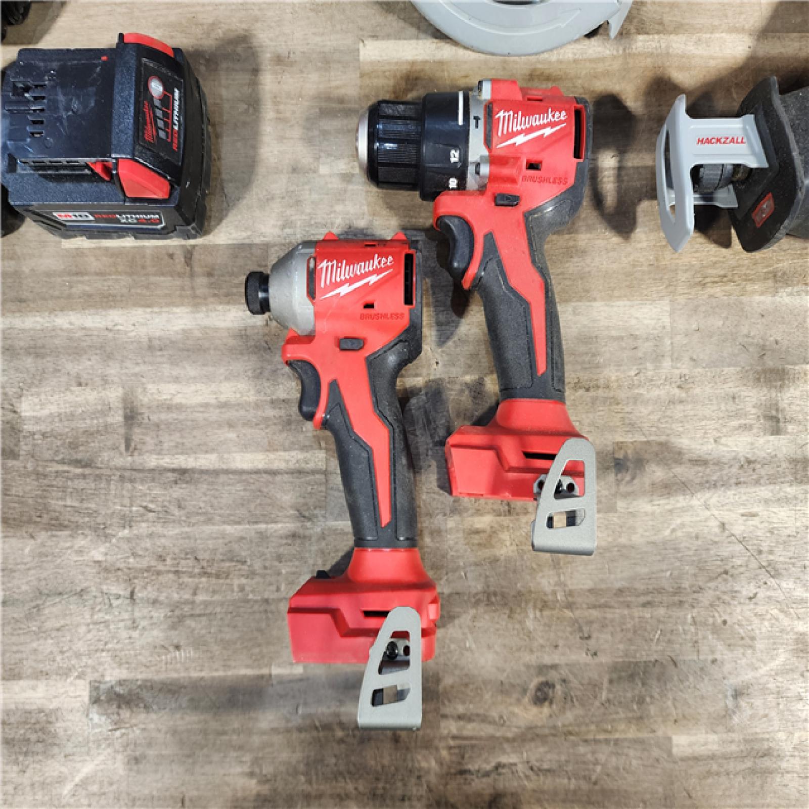 HOUSTON LOCATION - AS-IS Milwaukee M18 18-Volt Lithium-Ion Brushless Cordless Combo Kit (4-Tool) with 2-Batteries, 1-Charger and Tool Bag