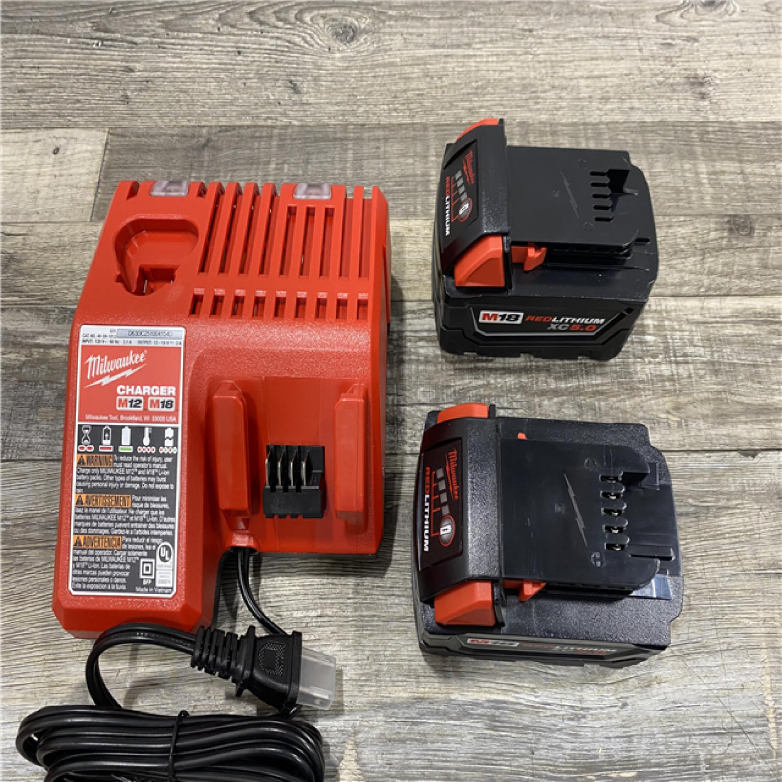 AS-IS Milwaukee 18-Volt Lithium-Ion XC Starter Kit with Two 5.0Ah Batteries and Charger