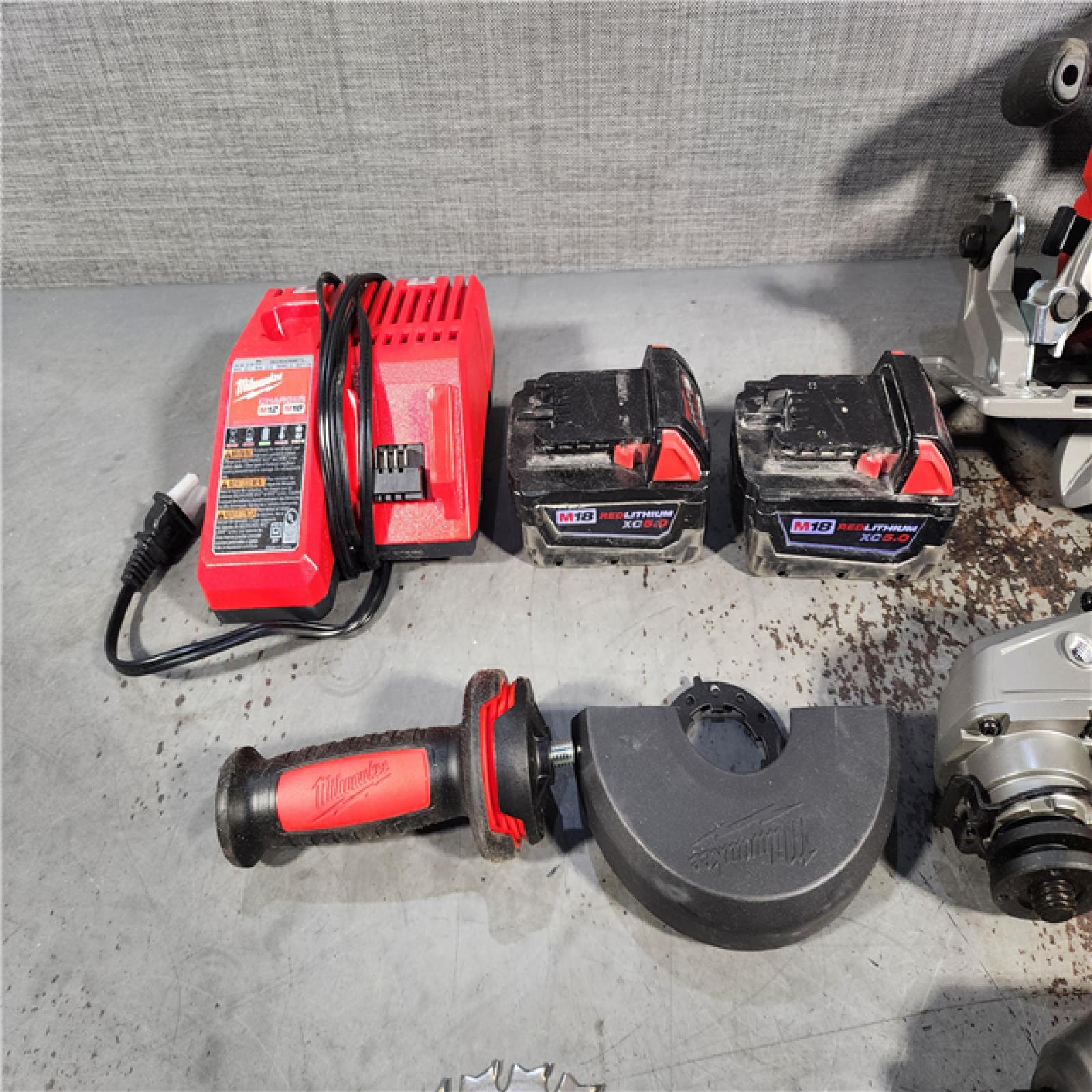 HOUSTON LOCATION - AS-IS MILWAUKEE 4 TOOL COMBO KIT W/ (2) BATTERY & CHARGER