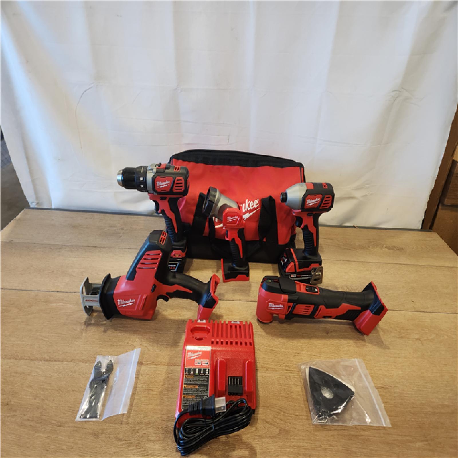 AS-IS- M18 18V Lithium-Ion Cordless Combo Kit (5-Tool) with (2) Batteries  Charger and Tool Bag