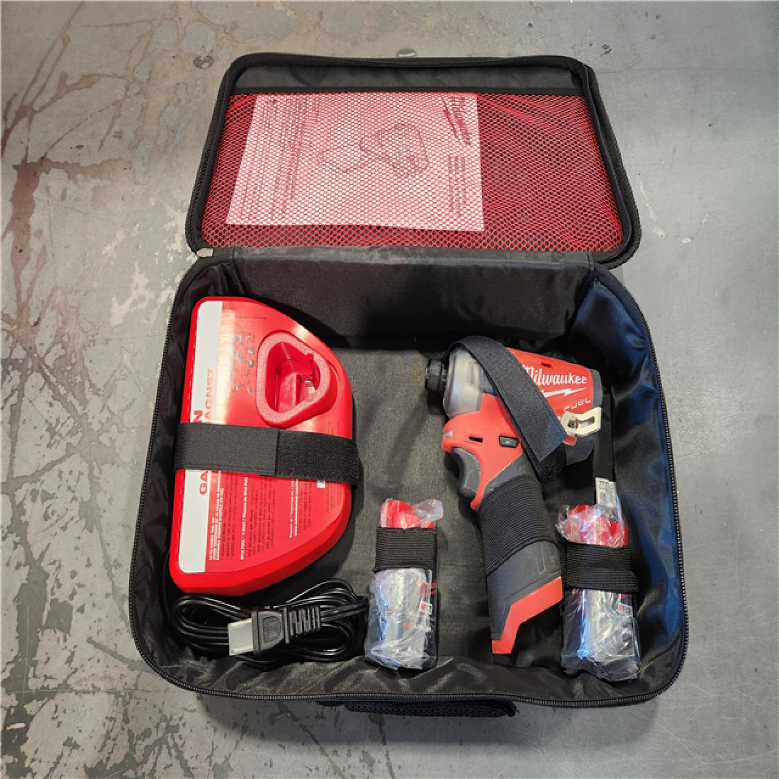 AS-IS- Milwaukee M12 FUEL SURGE 1/4 in. Cordless Brushless Hydraulic Impact Driver Kit (Battery & Charger)