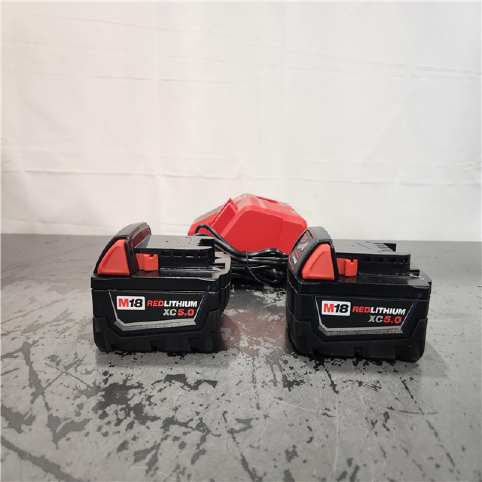 AS-IS- Milwaukee 18-Volt Lithium-Ion XC Starter Kit with Two 5.0Ah Batteries and Charger