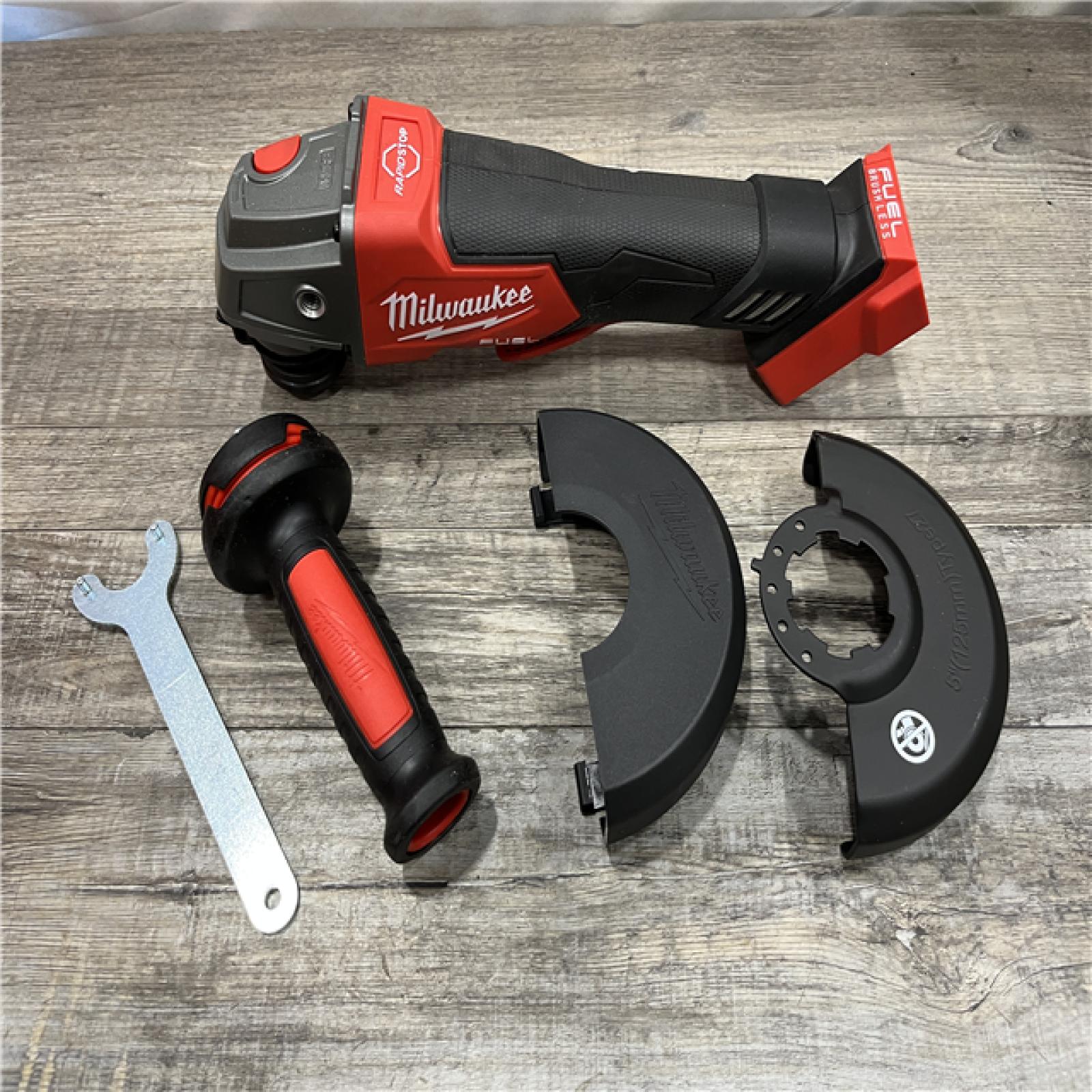AS-IS Milwaukee FUEL 18V Lithium-Ion Brushless Cordless 4-1/2 in./5 in. Grinder w/Paddle Switch (Tool-Only)