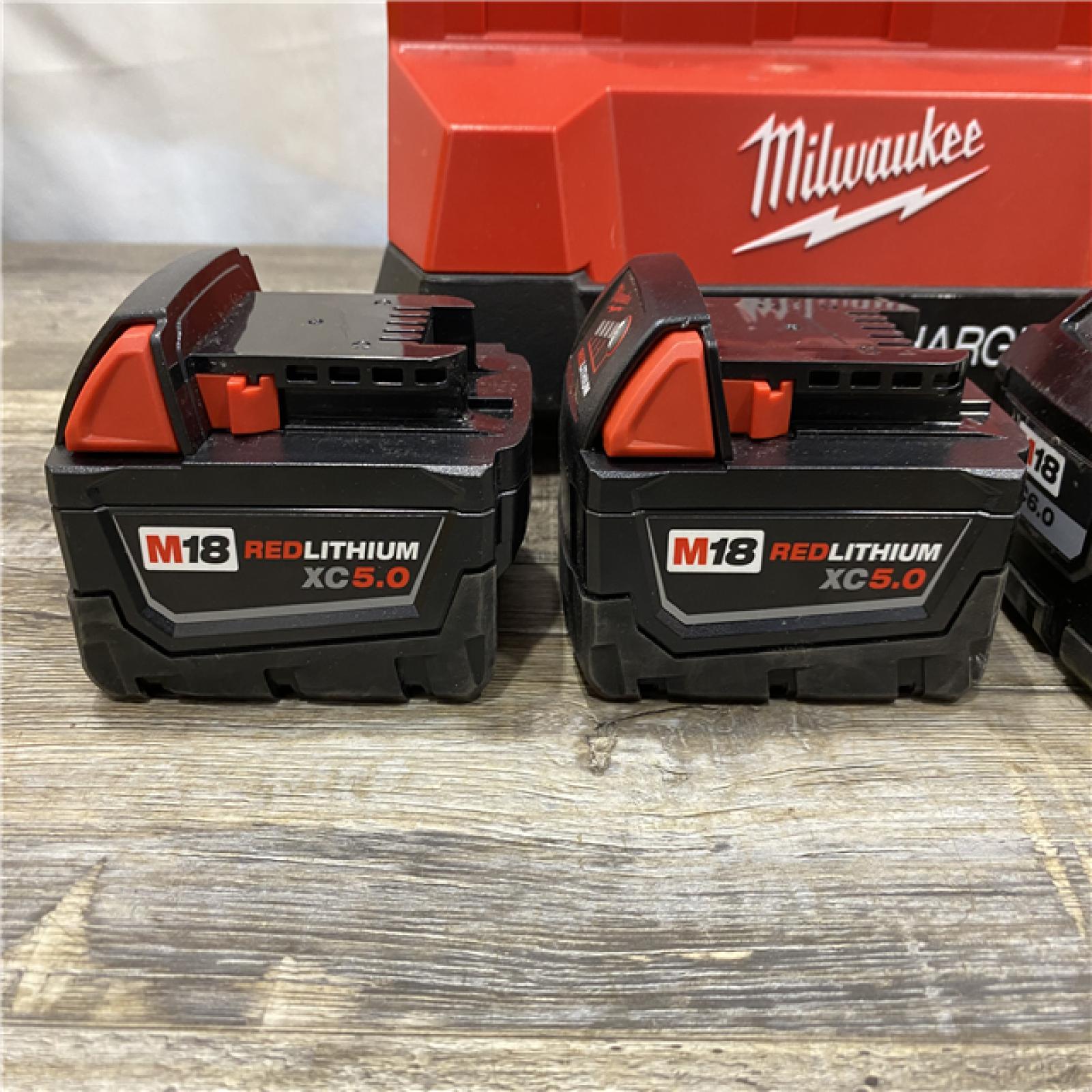 AS-IS Milwaukee 18-Volt Lithium-Ion Battery Pack (2) 5.0Ah and High Output Battery Pack (2) 6.0Ah with PACKOUT 6-Port Rapid Charger
