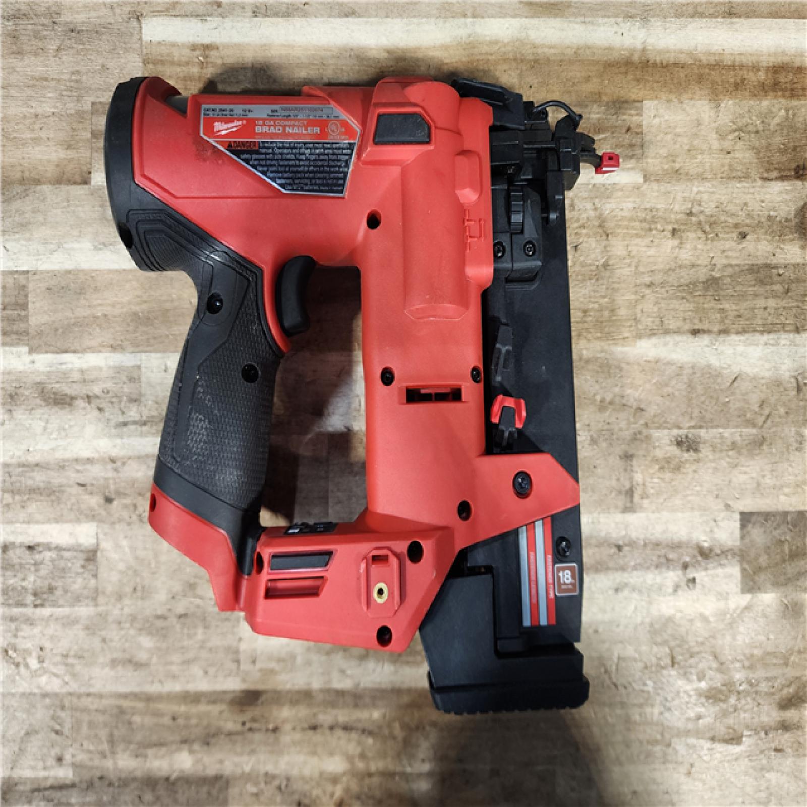 HOUSTON LOCATION - AS-IS Milwaukee FUEL 12-Volt Lithium-Ion Brushless Cordless 18-Gauge 1-1/2 in. Compact Brad Nailer (Tool Only)