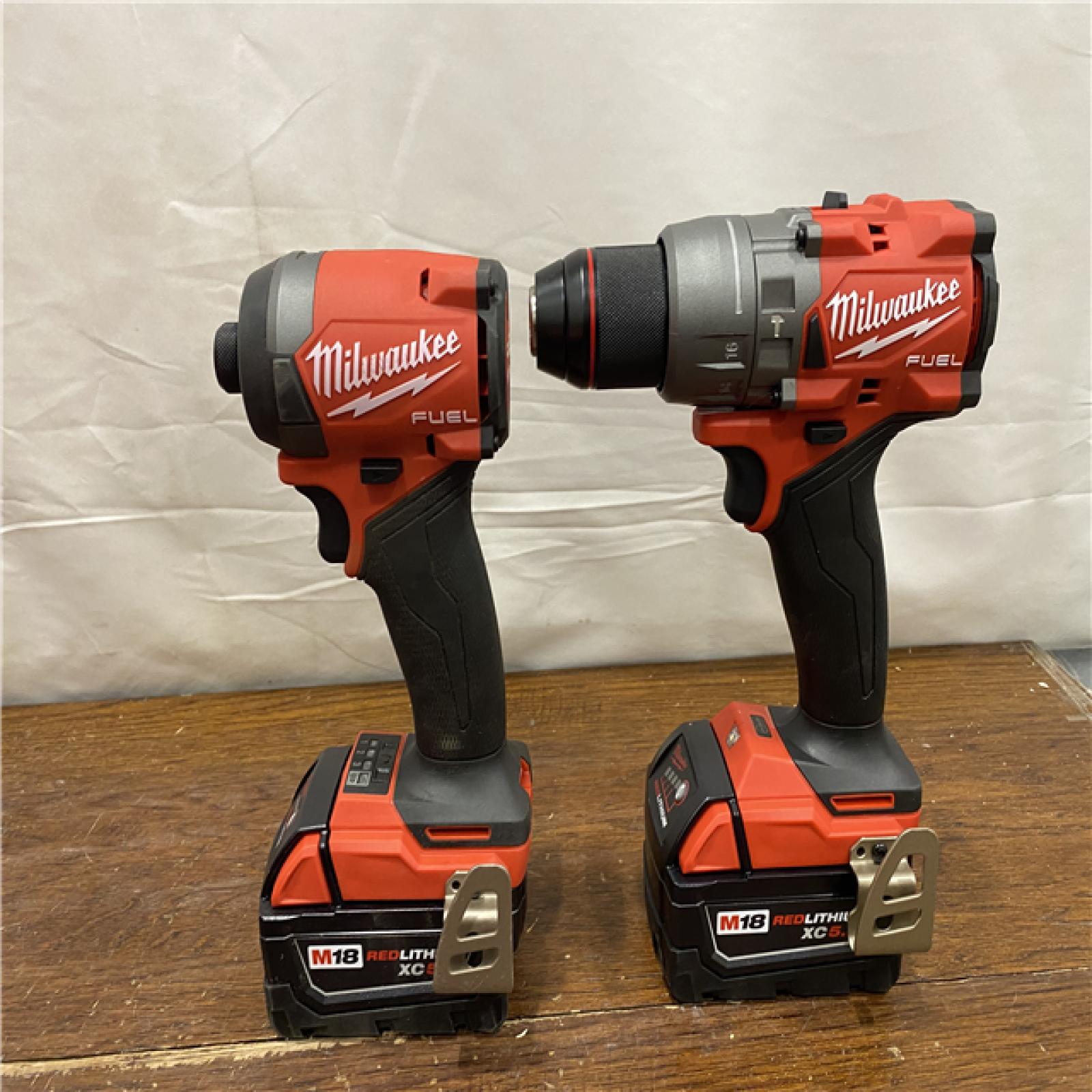 AS-IS MILWAUKEE M18 FUEL 18V Lithium-Ion Brushless Cordless Hammer Drill and Impact Driver Combo Kit (2-Tool) with 2 Batteries