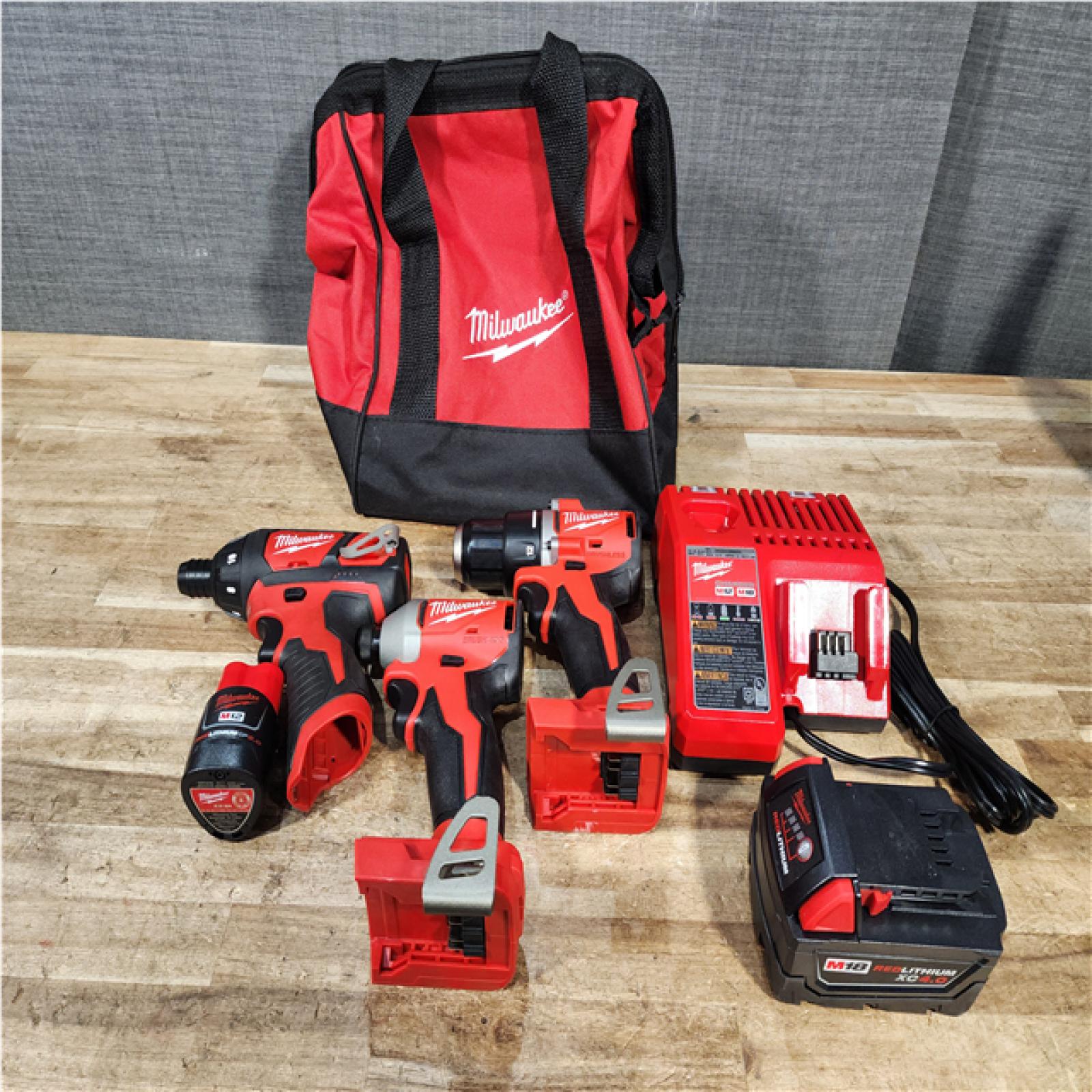 Houston Location AS-IS Milwaukee Drill and impact and Screwdriver Drill and Batteries QTY/2 and Charger