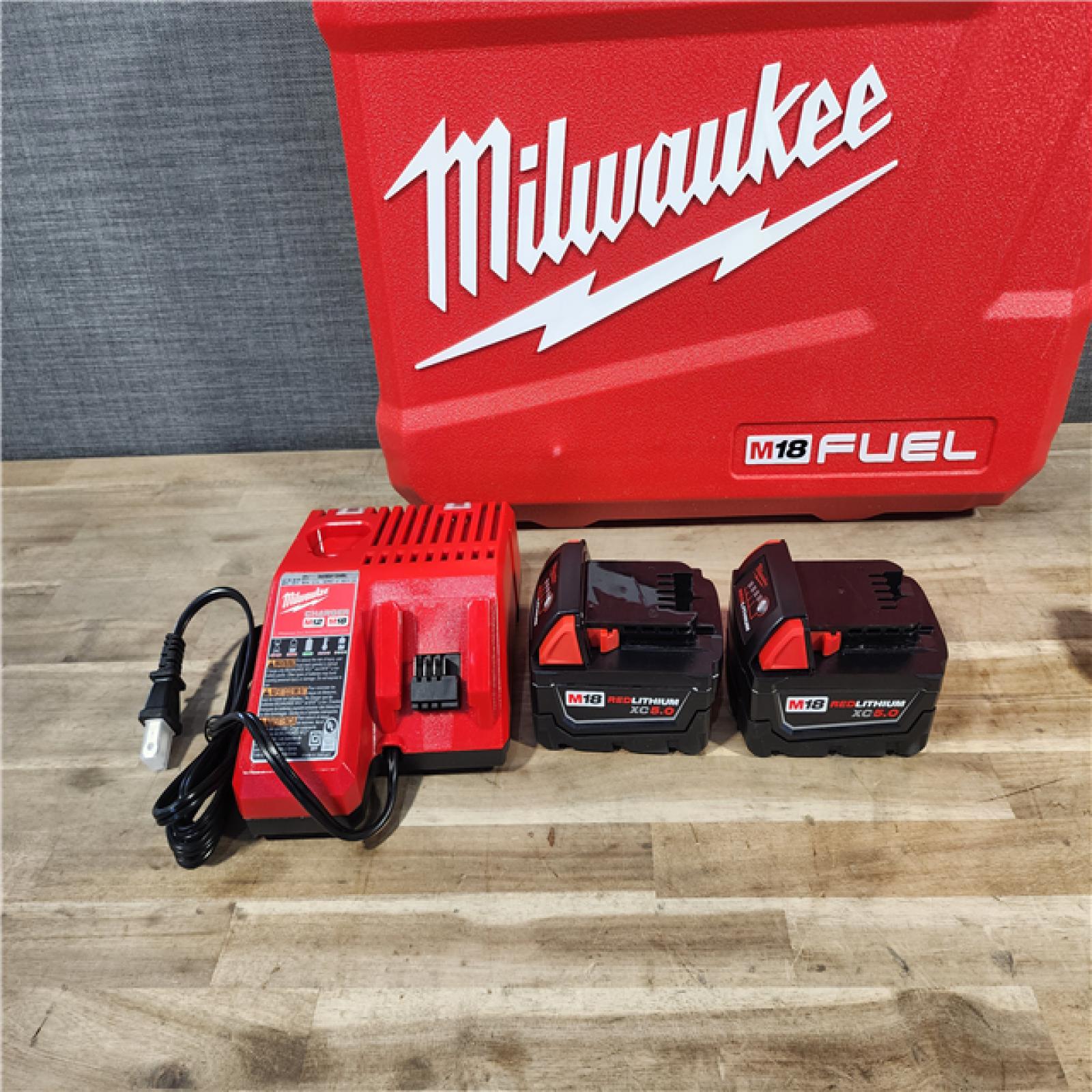 HOUSTON LOCATION - AS-IS (APPEARS LIKE NEW) MILWAUKEE FUEL 18V Lithium-Ion Brushless Cordless Hammer Drill and Impact Driver Combo Kit (2-Tool) with 2 Batteries