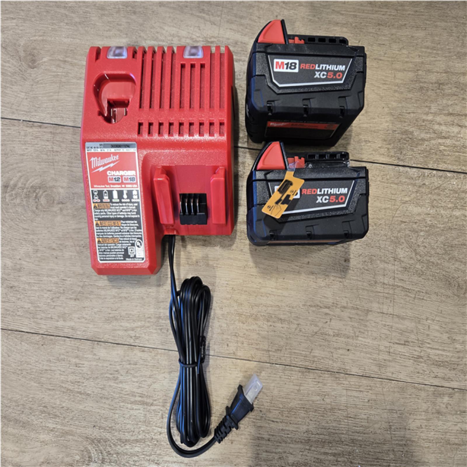AS-IS Milwaukee FUEL 18V Lithium-Ion Brushless Cordless Hammer Drill and Impact Driver Combo Kit