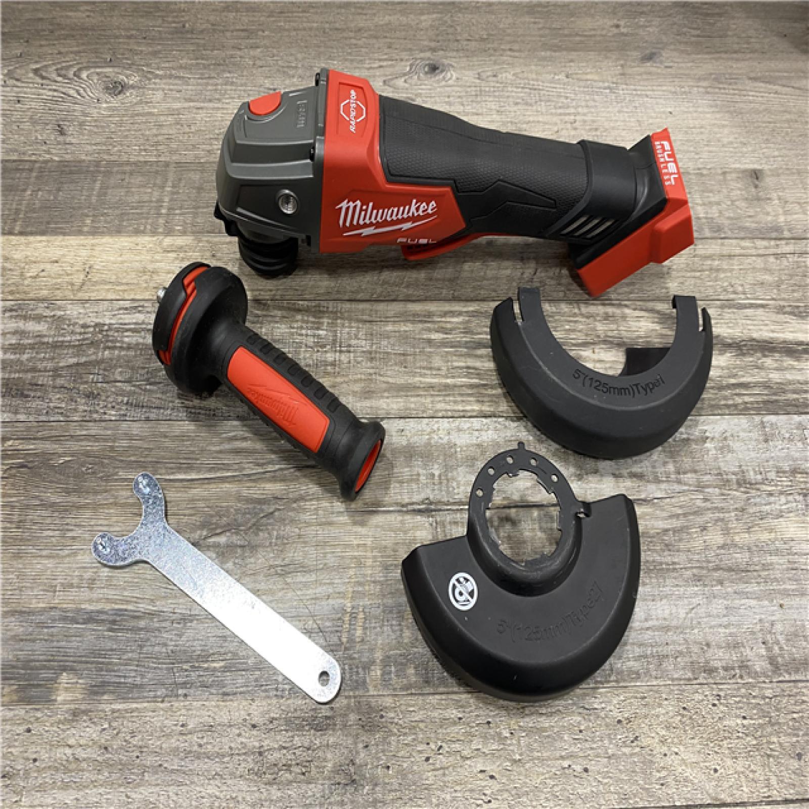 AS-IS Milwaukee  FUEL 18V Lithium-Ion Brushless Cordless 4-1/2 in./5 in. Grinder w/Paddle Switch (Tool-Only)