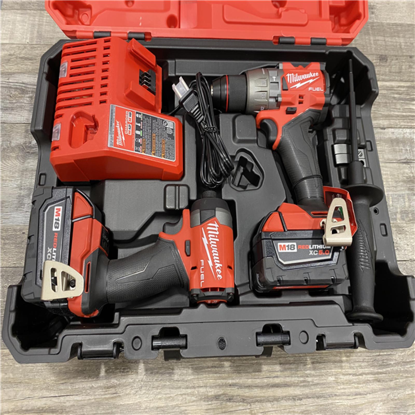 AS-IS Milwaukee FUEL 18V Lithium-Ion Brushless Cordless Hammer Drill and Impact Driver Combo Kit