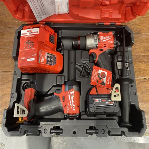AS-IS MILWAUKEE M18 FUEL 18V Lithium-Ion Brushless Cordless Hammer Drill and Impact Driver Combo Kit (2-Tool) with 2 Batteries
