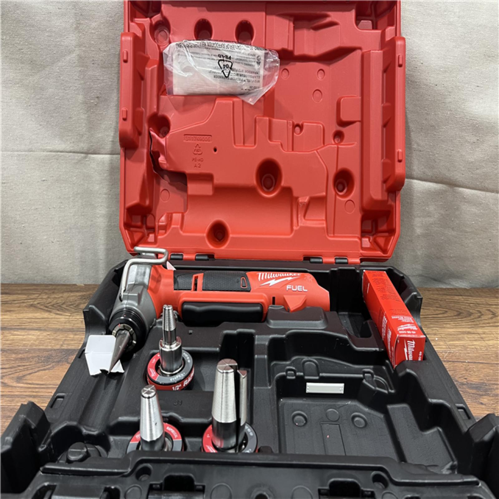 AS-IS MILWAUKEE M12 FUEL ProPEX Expander Tool with 1/2 in. - 1 in. RAPID SEAL ProPEX Expander Heads