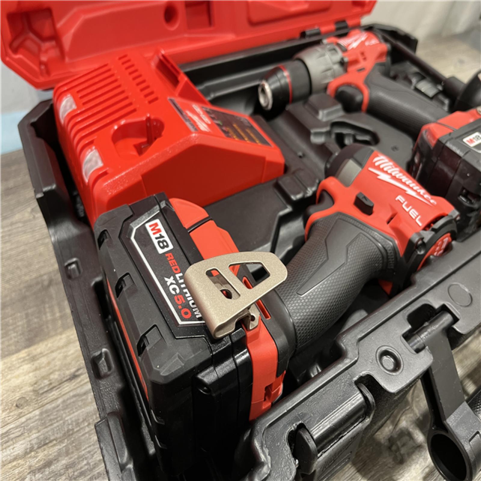 AS-IS Milwaukee FUEL 18V Lithium-Ion Brushless Cordless Hammer Drill and Impact Driver Combo Kit