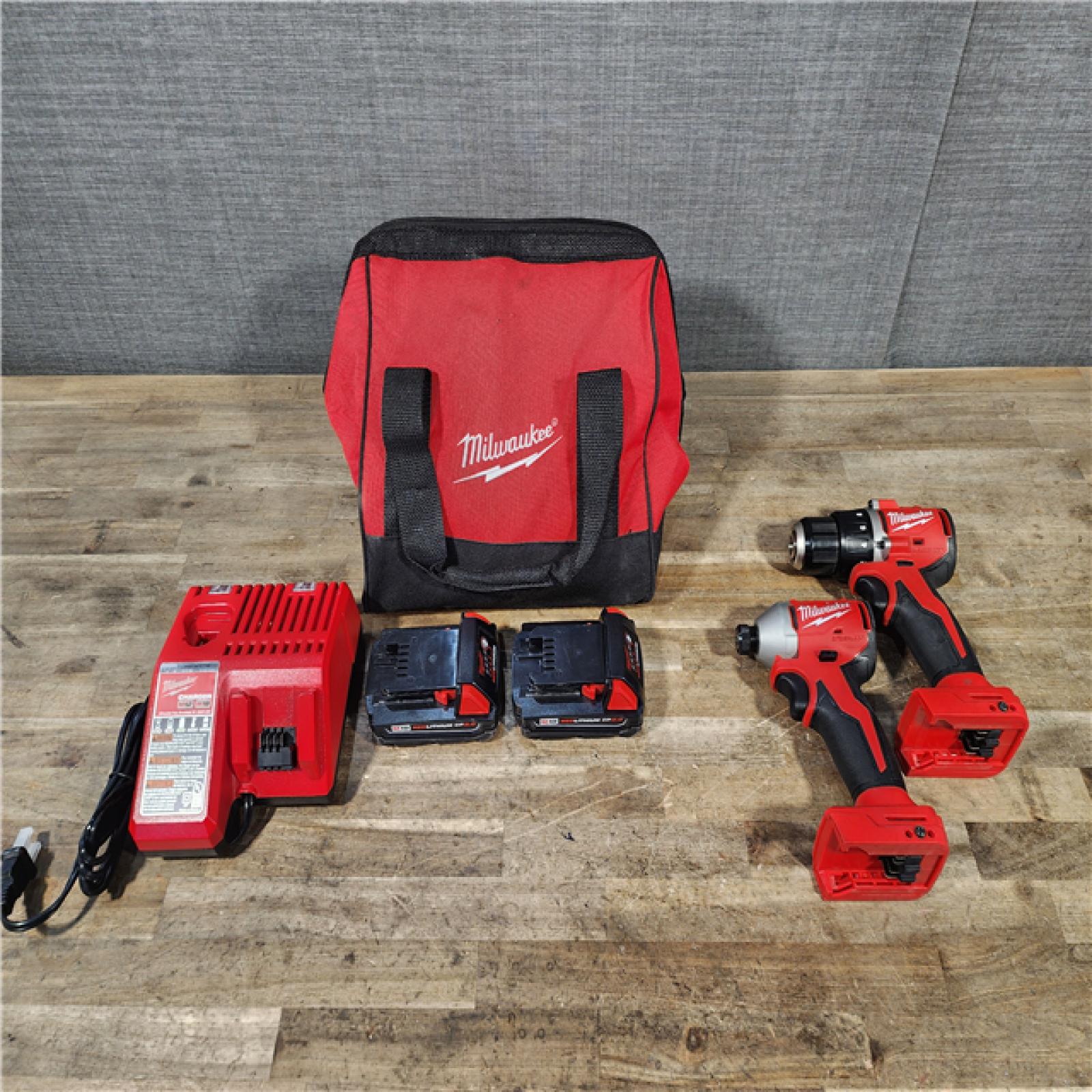 HOUSTON LOCATION - AS-IS Milwaukee M18 18V Lithium-Ion Brushless Cordless Compact Drill/Impact Combo Kit (2-Tool) W/(2) 2.0 Ah Batteries  Charger & Bag
