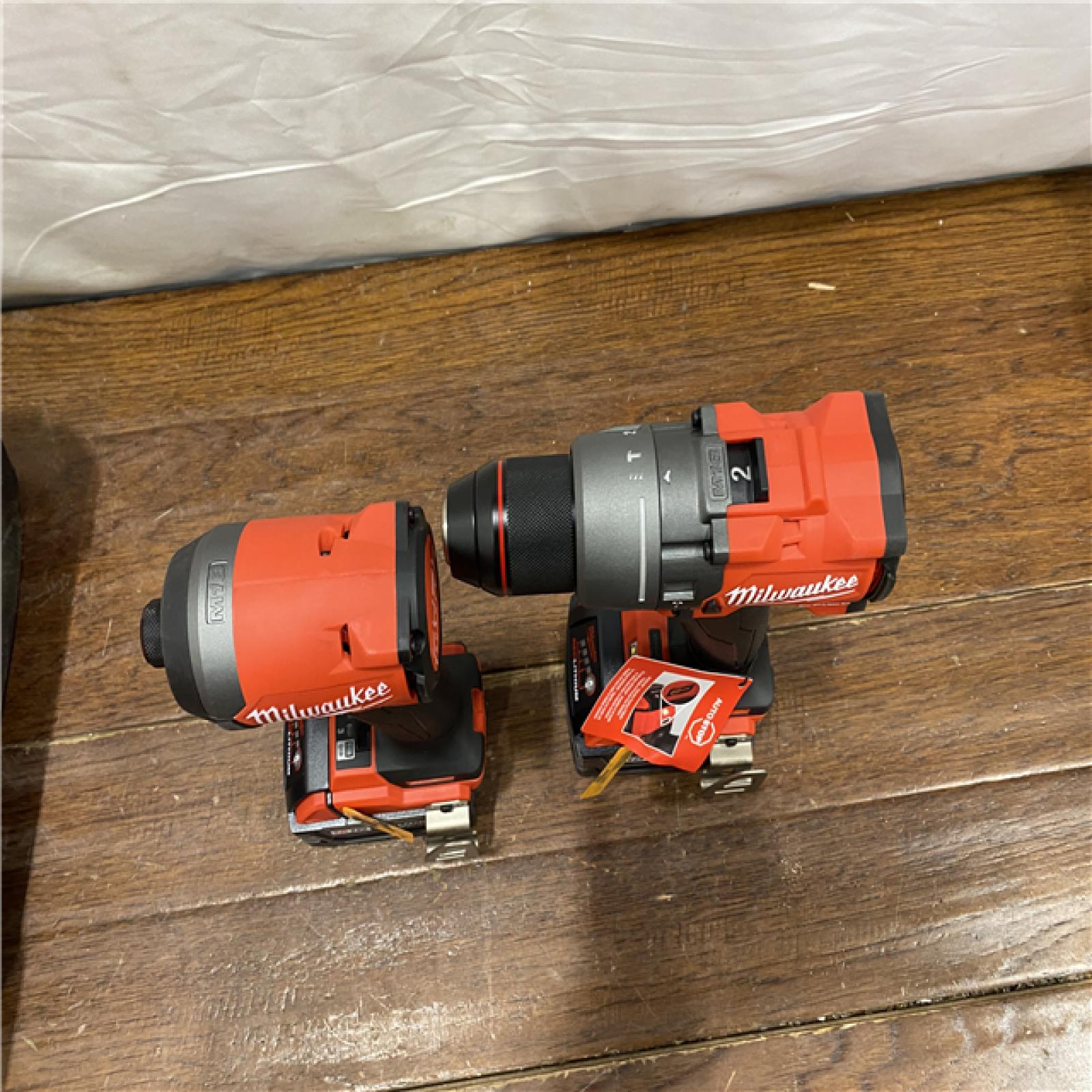 AS-IS MILWAUKEE M18 FUEL 18V Lithium-Ion Brushless Cordless Hammer Drill and Impact Driver Combo Kit (2-Tool) with 2 Batteries