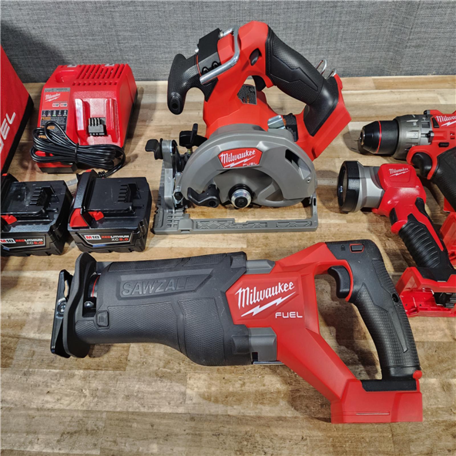 HOUSTON LOCATION - AS-IS MILWAUKEE 4 TOOL COMBO KIT W/ (2) BATTERY & CHARGER