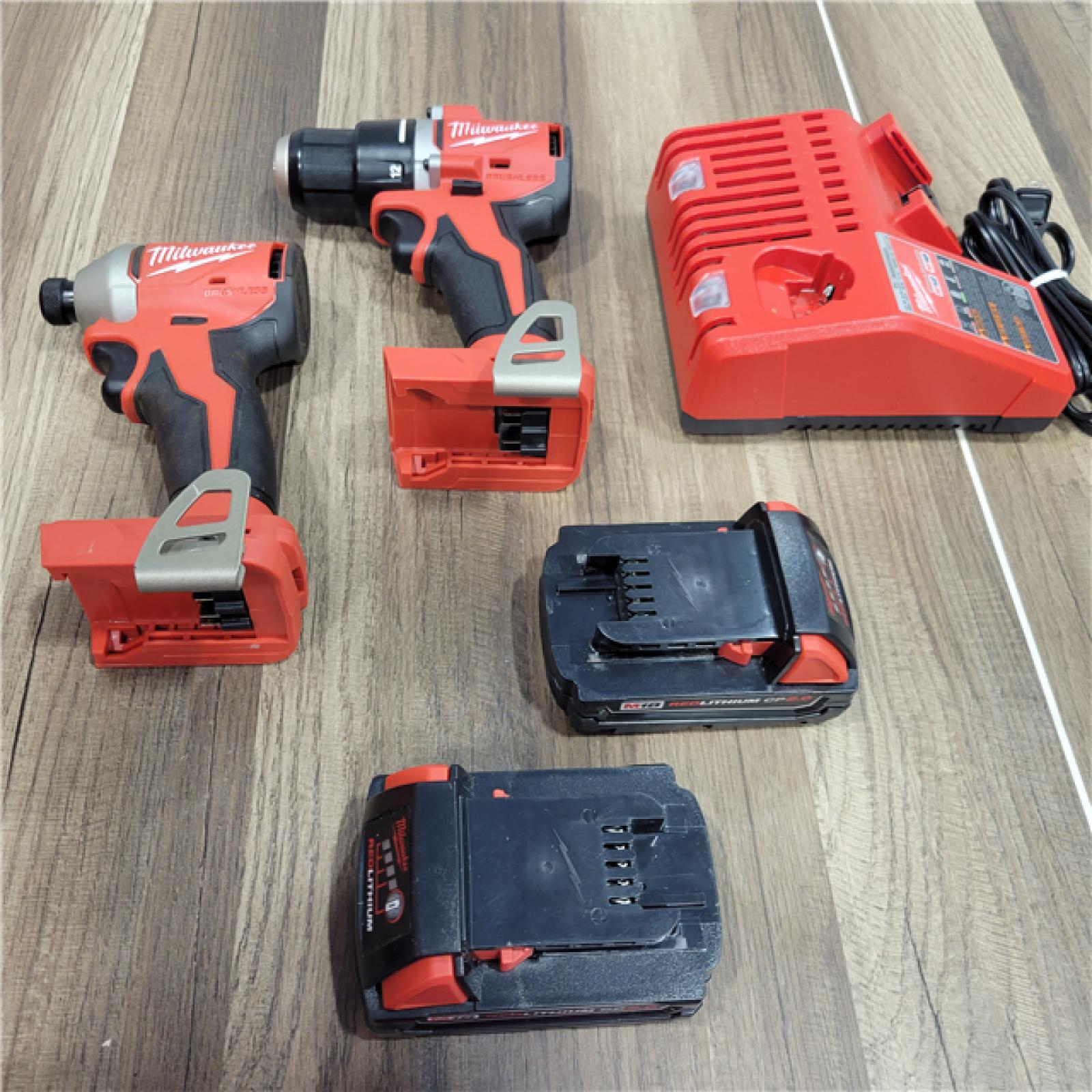 AS-IS Milwaukee M18 18V Lithium-Ion Brushless Cordless Compact Drill/Impact Combo Kit (2-Tool) W/(2) 2.0 Ah Batteries, Charger & Bag