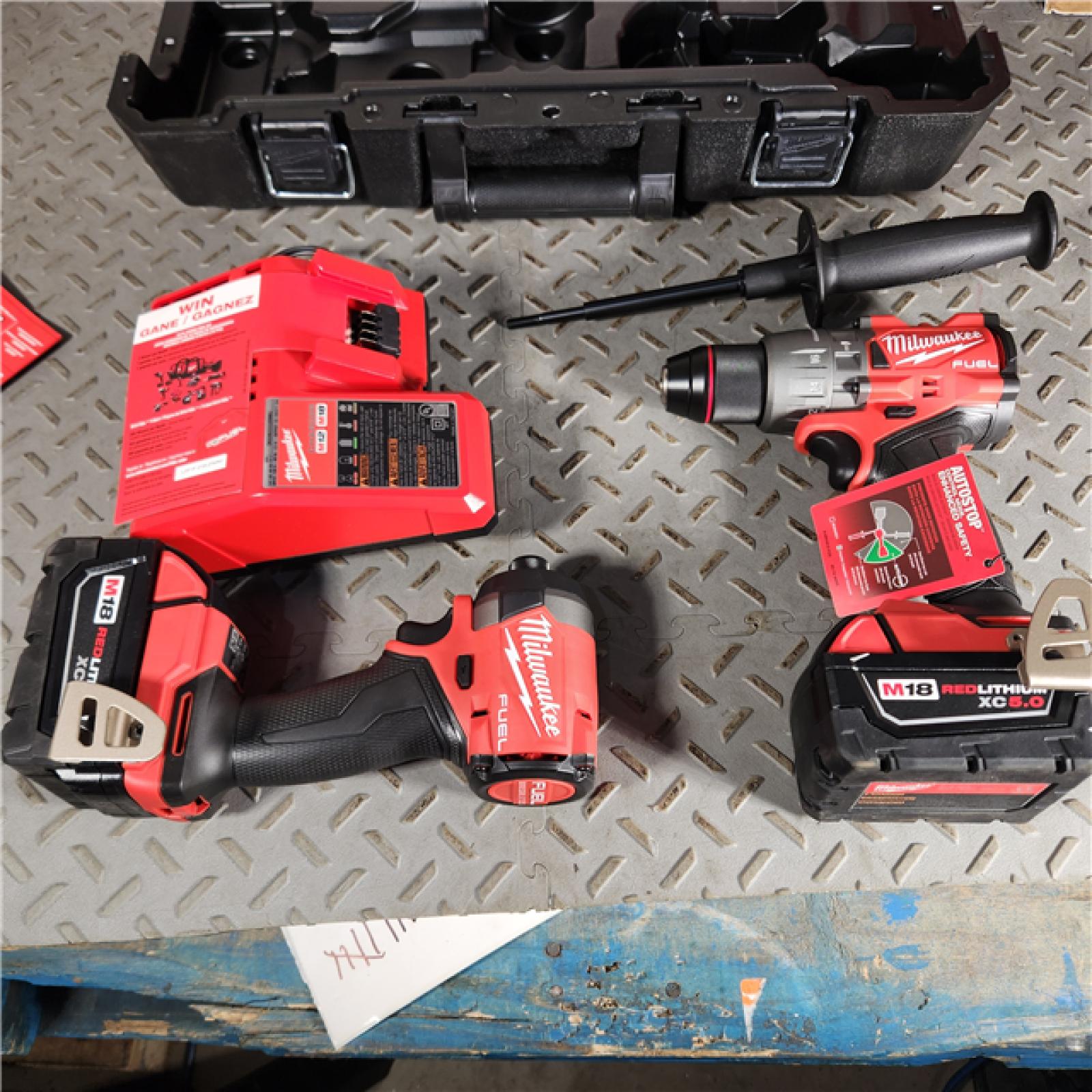 Houston location- AS-IS Milwaukee 3697-22 M18 FUEL 1/2 Hammer Driller/Driver &1/4 Hex Impact Driver 2 Tool Combo Kit