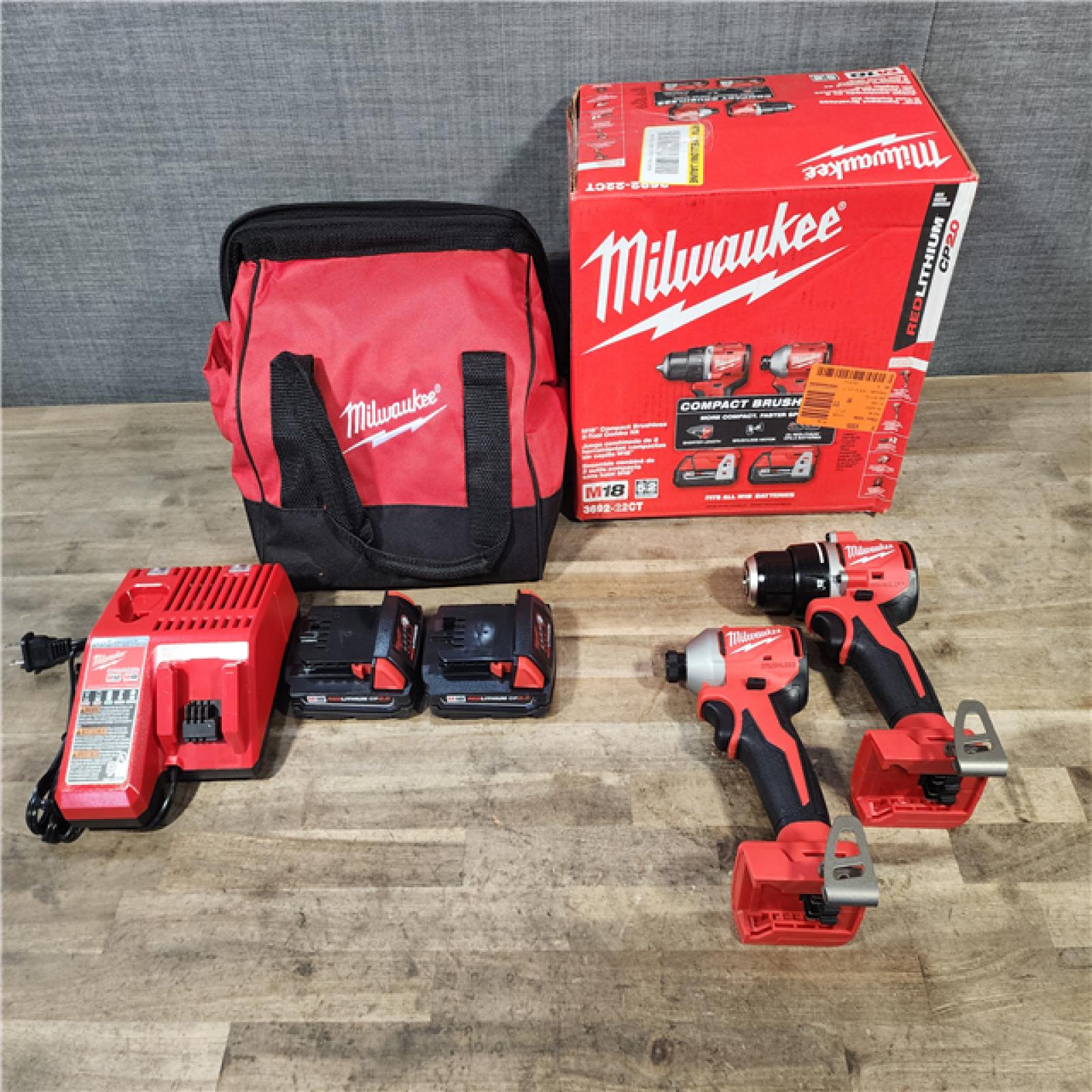 HOUSTON LOCATION - AS-IS Milwaukee M18 18V Lithium-Ion Brushless Cordless Compact Drill/Impact Combo Kit (2-Tool) W/(2) 2.0 Ah Batteries  Charger & Bag
