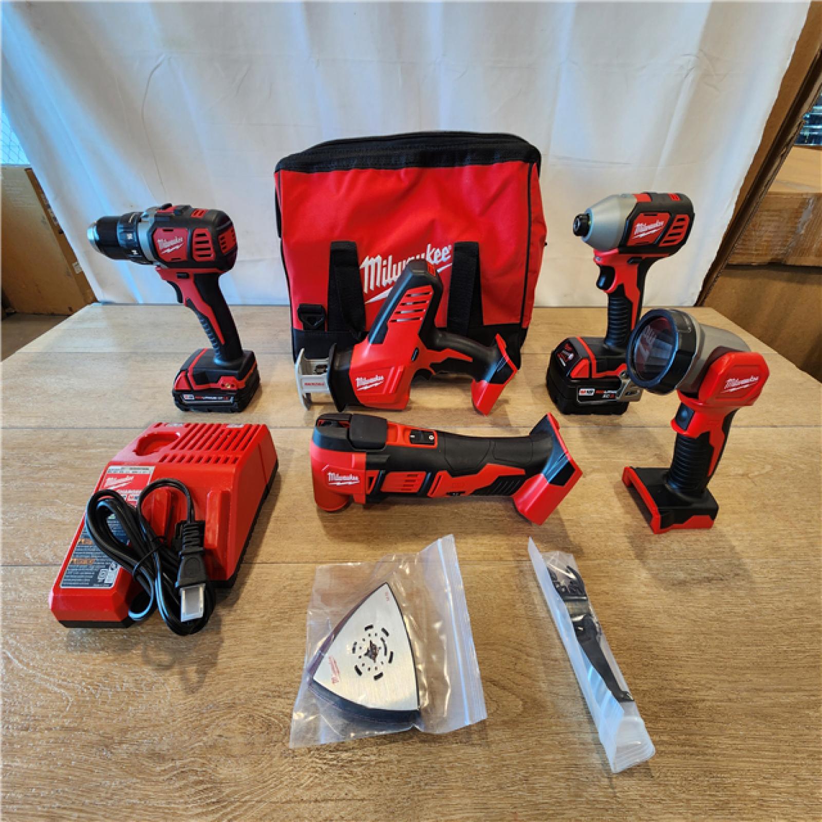 AS-IS- M18 18V Lithium-Ion Cordless Combo Kit (5-Tool) with (2) Batteries  Charger and Tool Bag
