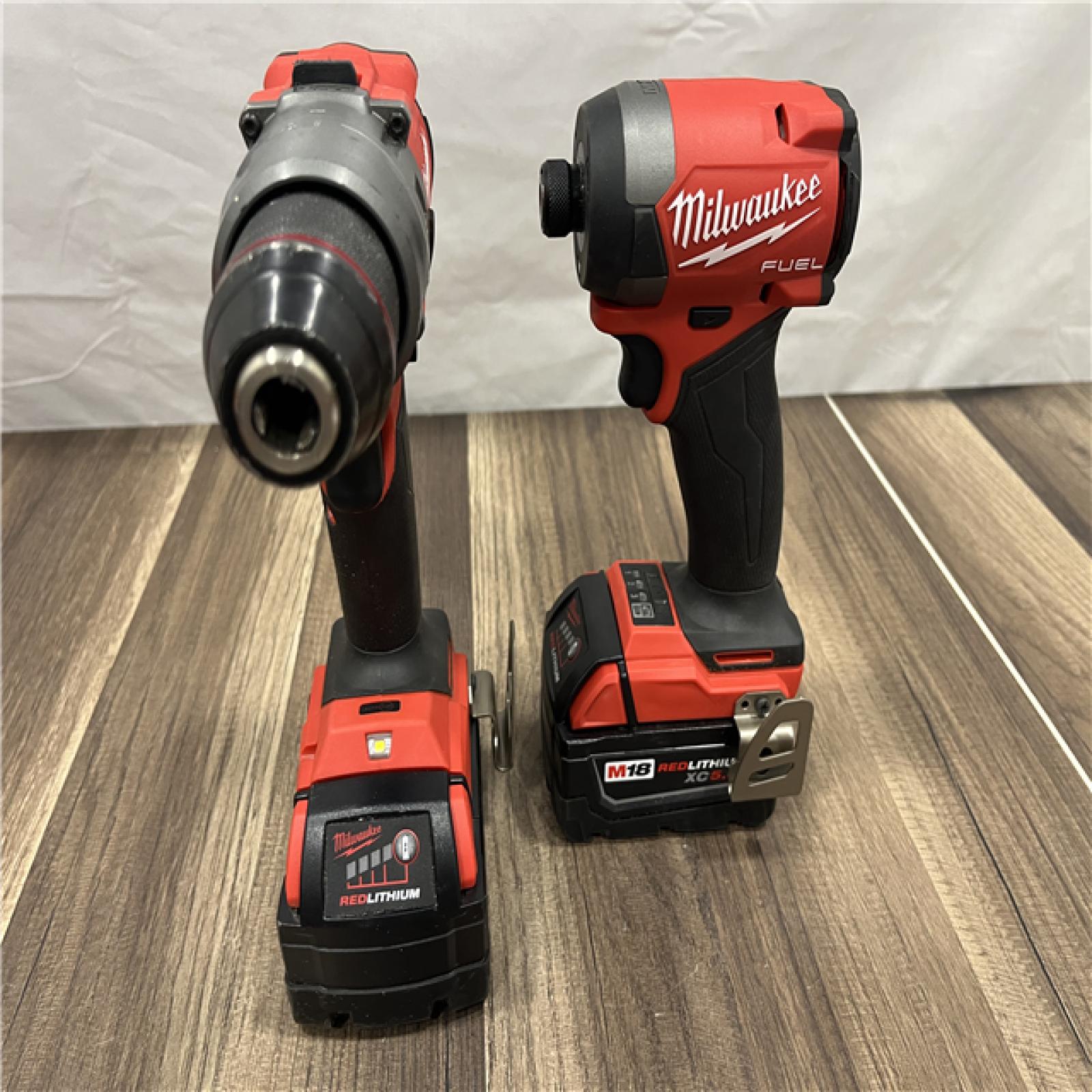 AS-IS MILWAUKEE FUEL 18V Lithium-Ion Brushless Cordless Hammer Drill and Impact Driver Combo Kit (2-Tool) with 2 Batteries