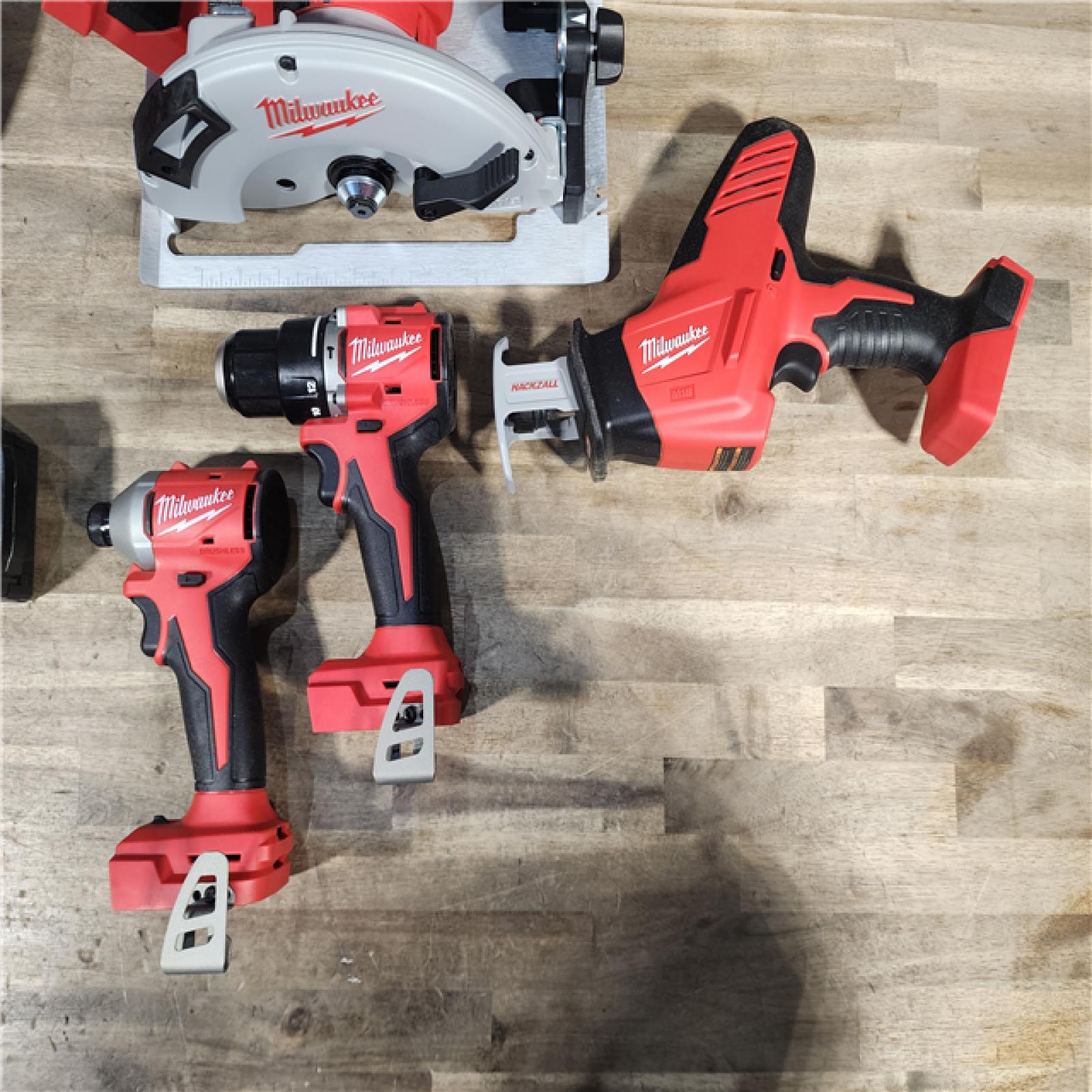 HOUSTON LOCATION - AS-IS (APPEARS LIKE NEW) Milwaukee M18 18-Volt Lithium-Ion Brushless Cordless Combo Kit (4-Tool) with 2-Batteries, 1-Charger and Tool Bag