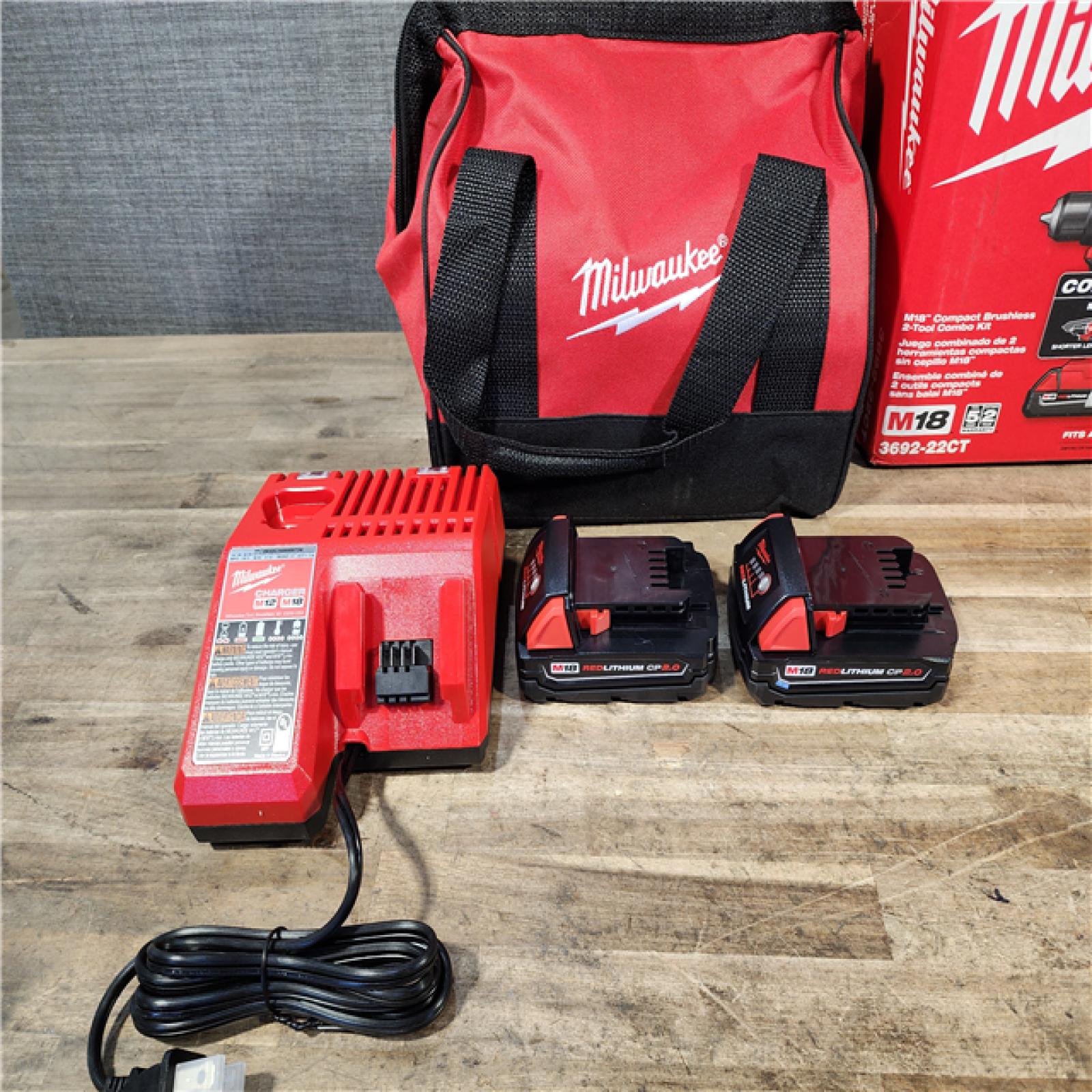 HOUSTON LOCATION - AS-IS Milwaukee M18 18V Lithium-Ion Brushless Cordless Compact Drill/Impact Combo Kit (2-Tool) W/(2) 2.0 Ah Batteries  Charger & Bag