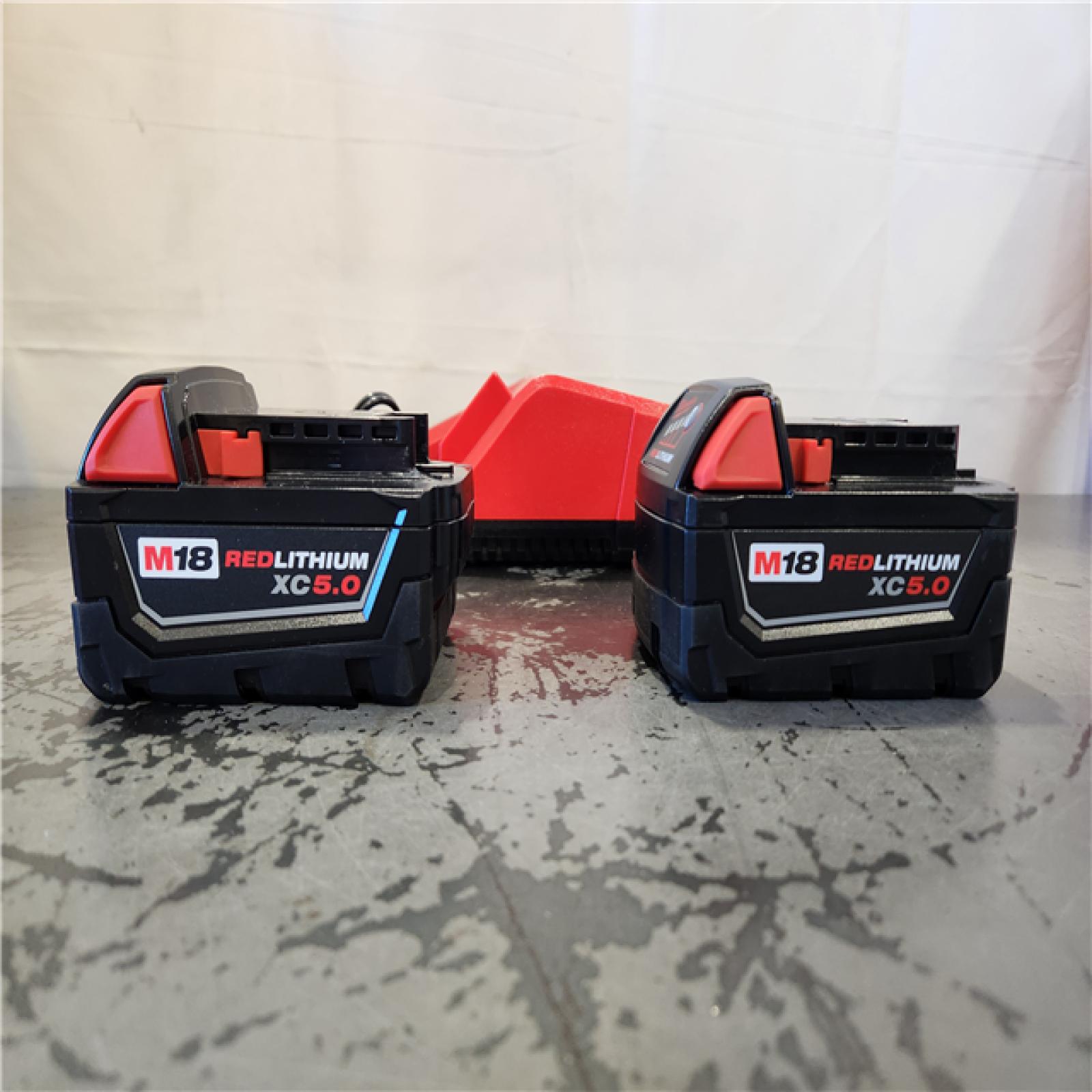AS-IS- Milwaukee 18-Volt Lithium-Ion XC Starter Kit with Two 5.0Ah Batteries and Charger