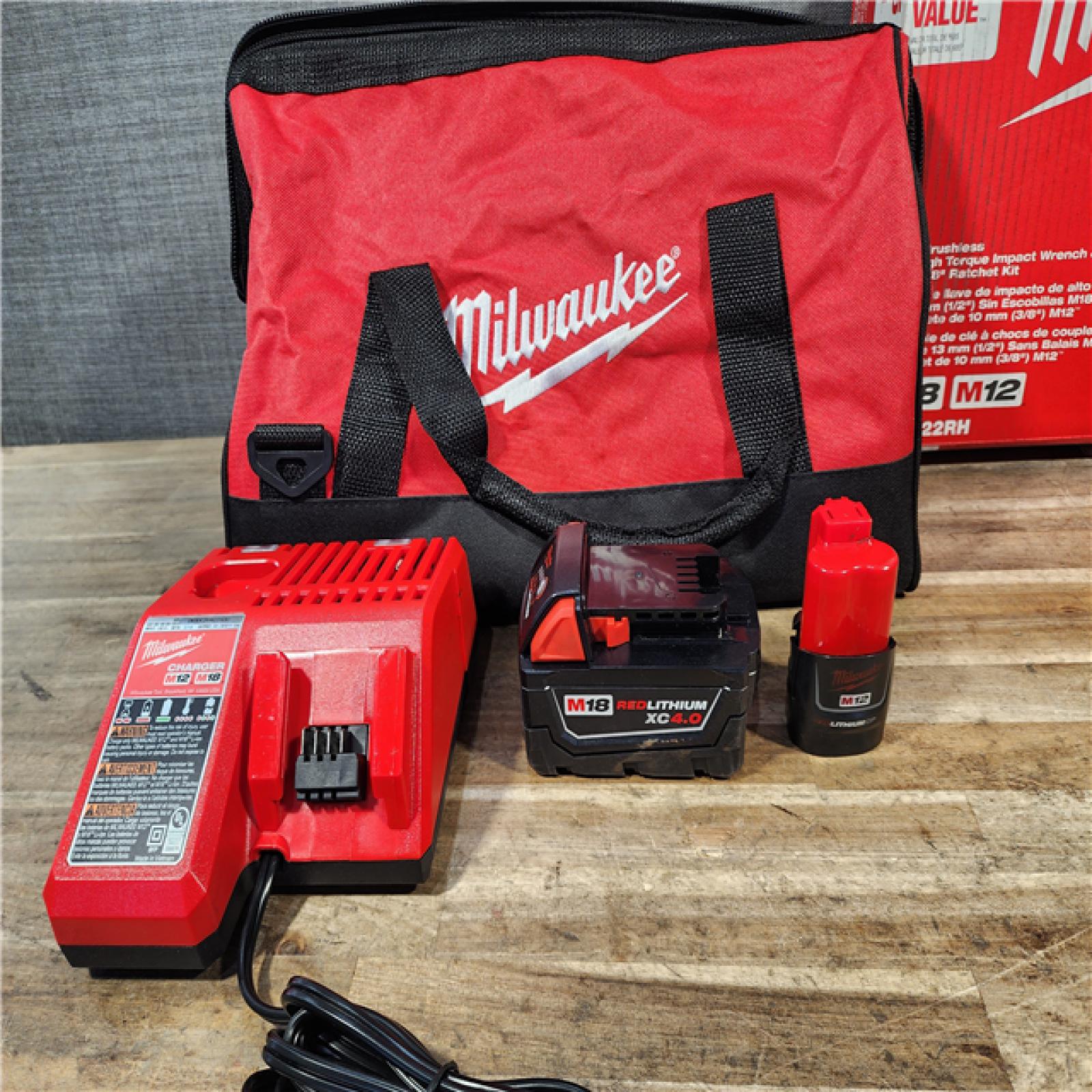 HOUSTON LOCATION - AS-IS Milwaukee 12/18V Lithium-Ion Cordless 3/8 in. Ratchet and 1/2 in. High Torque Impact Wrench with Friction Ring Combo Kit