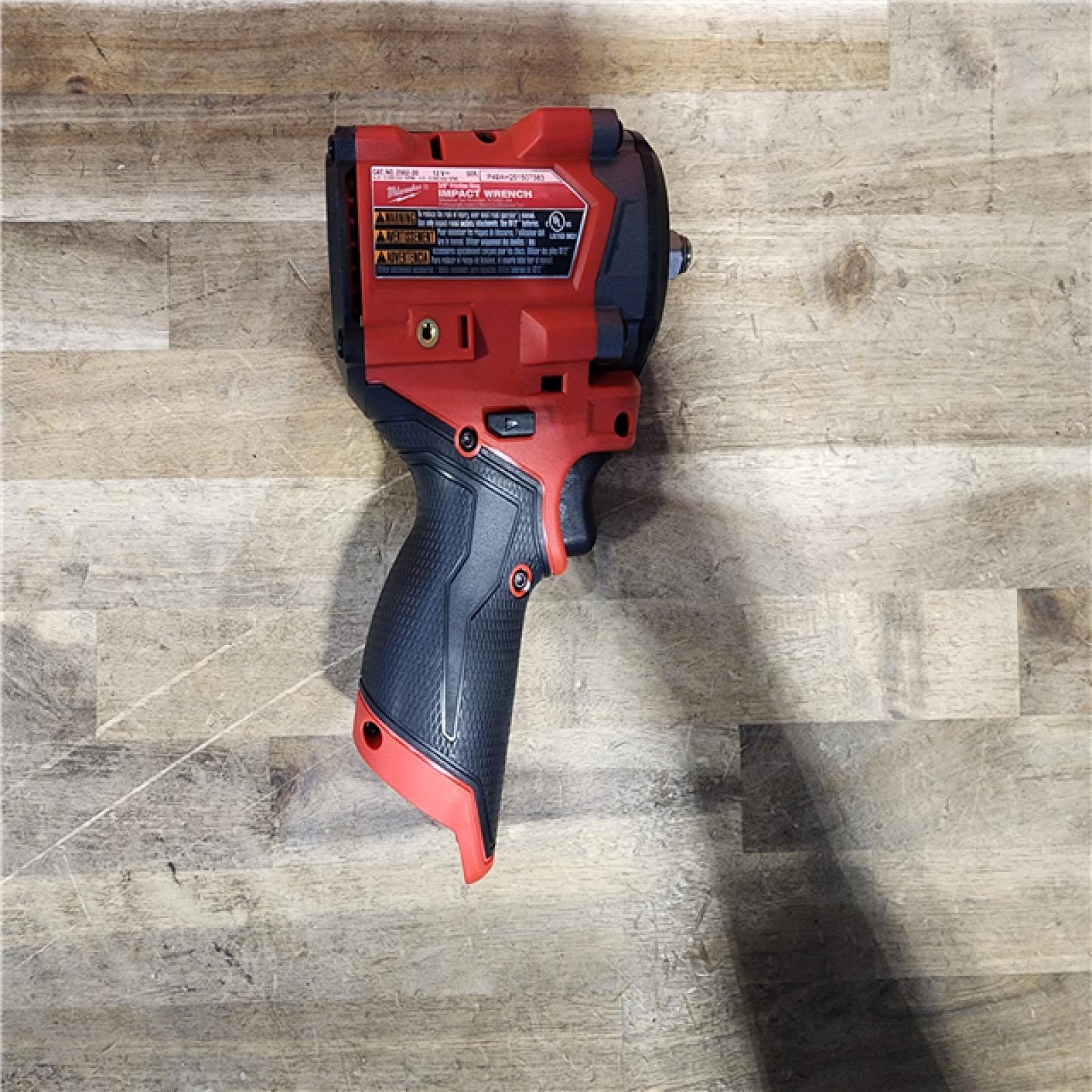 HOUSTON LOCATION - AS-IS (APPEARS LIKE NEW) Milwaukee M12 FUEL 12V Li-Ion Brushless Cordless Stubby 3/8 in. Impact Wrench Kit W/(1) 5.0 Ah High Output Battery