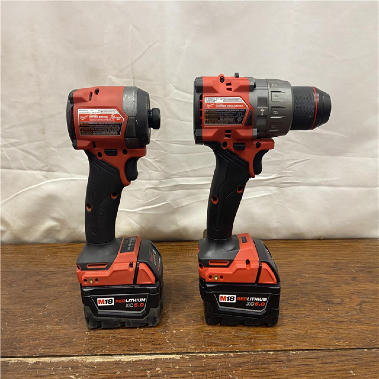 AS-IS MILWAUKEE M18 FUEL 18V Lithium-Ion Brushless Cordless Hammer Drill and Impact Driver Combo Kit (2-Tool) with 2 Batteries