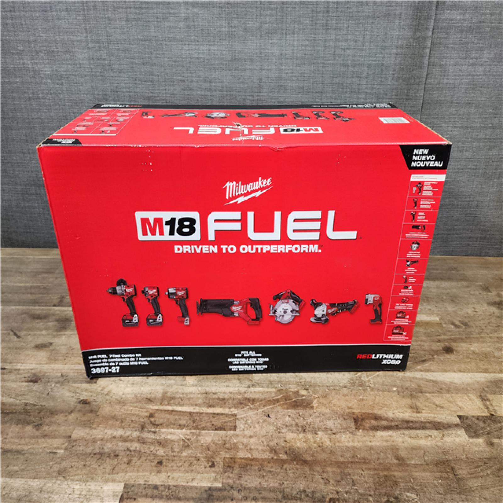 HOUSTON LOCATION - AS-IS (NEW) Milwaukee M18 FUEL 18V Lithium-Ion Brushless Cordless Combo Kit with Two 5.0 Ah Batteries  1 Charger  2 Tool Bags (7-Tool)