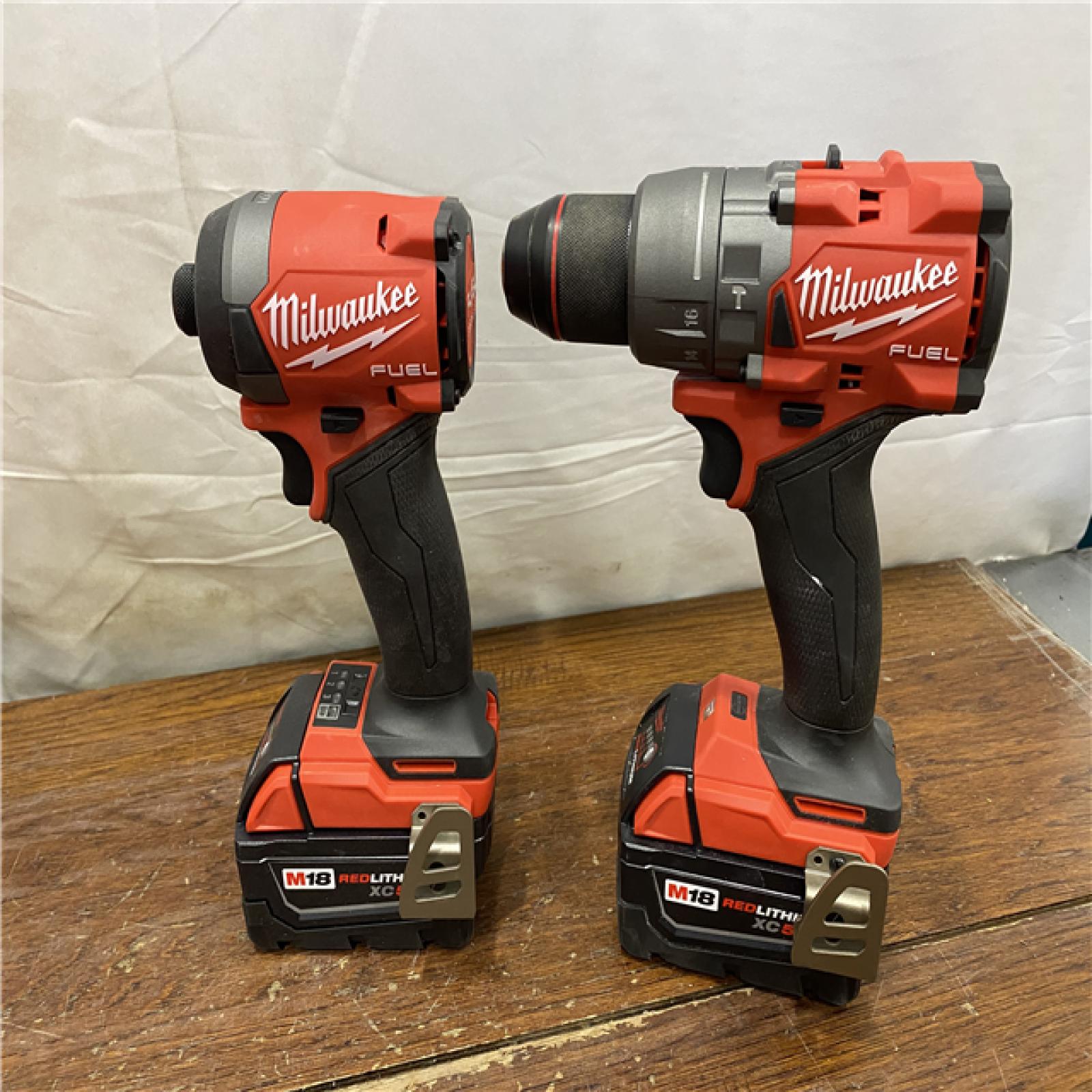 AS-IS MILWAUKEE M18 FUEL 18V Lithium-Ion Brushless Cordless Hammer Drill and Impact Driver Combo Kit (2-Tool) with 2 Batteries