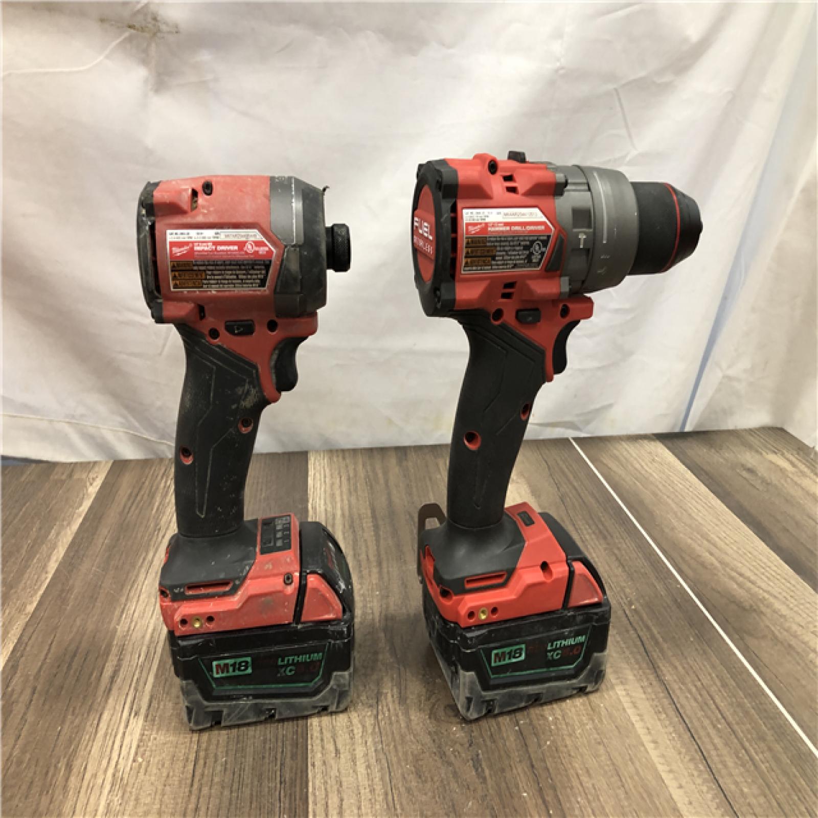 AS-IS Milwaukee FUEL 18V Lithium-Ion Brushless Cordless Hammer Drill and Impact Driver Combo Kit