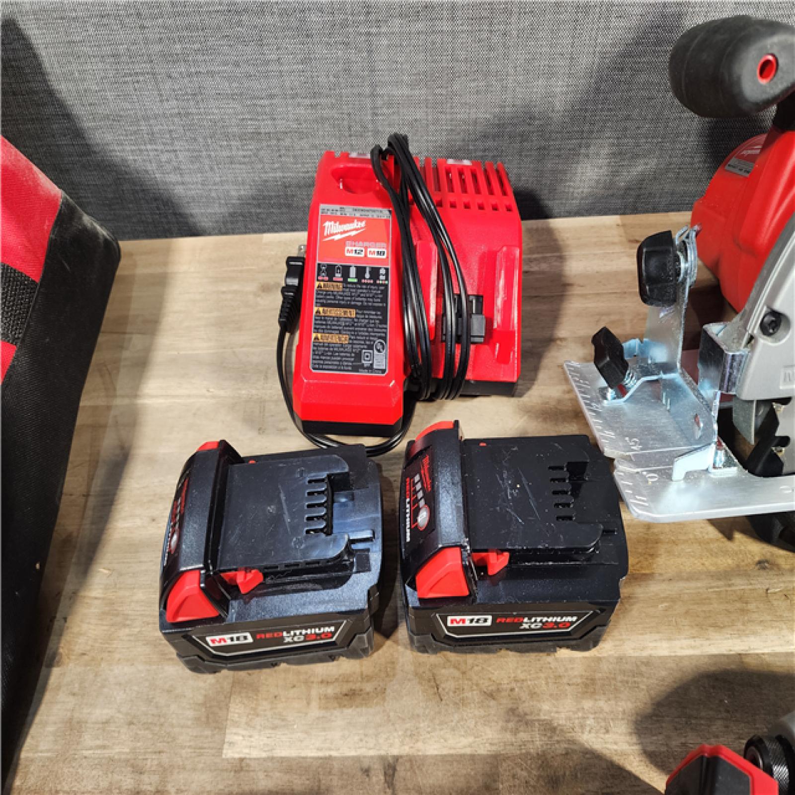 HOUSTON LOCATION - AS-IS Milwaukee M18 18-Volt Lithium-Ion Cordless Combo Kit 7-Tool with 2-Batteries, Charger and Tool Bag
