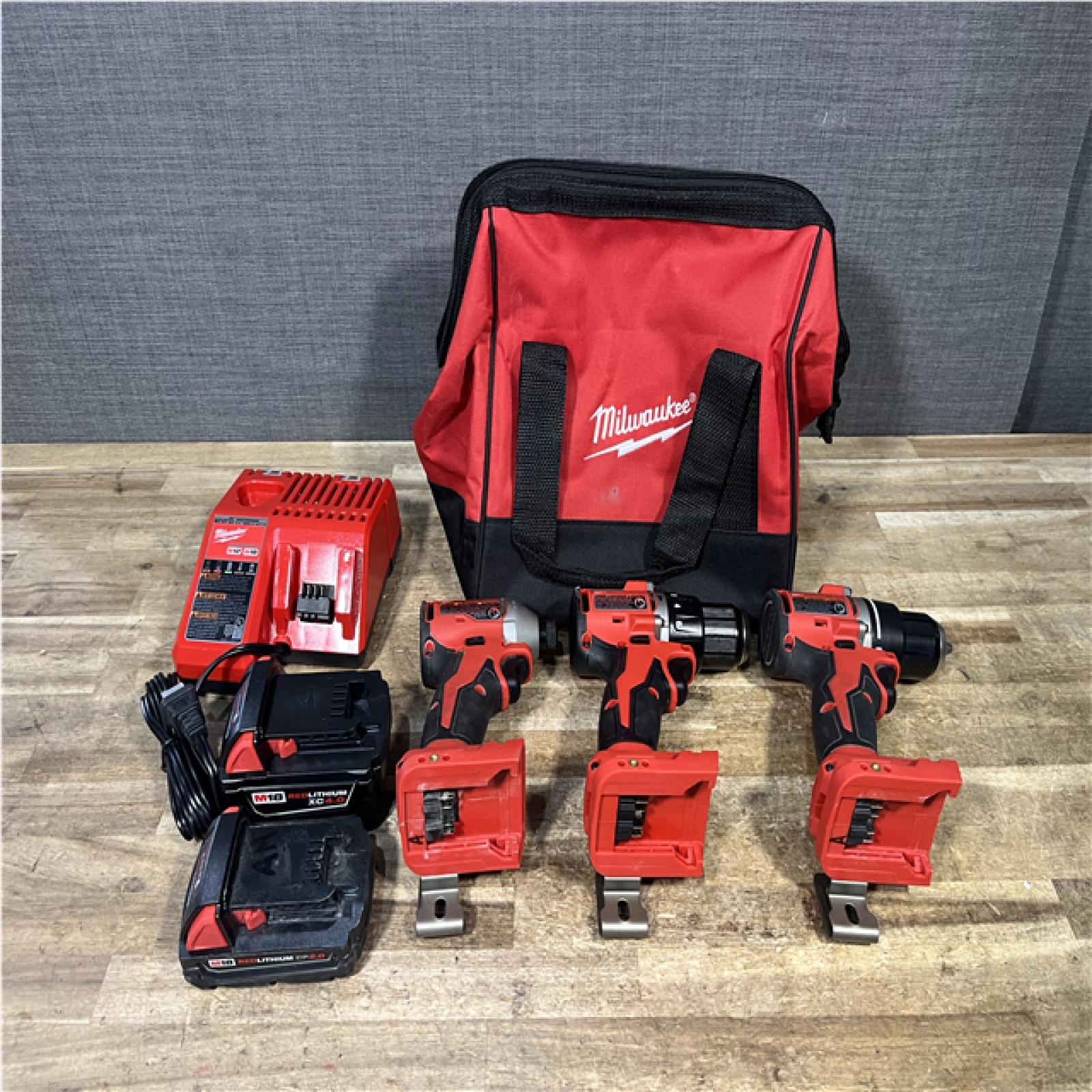 Houston Location AS-IS Milwaukee Hammer Drill Driver and Drill Driver and Impact Driver and Batteries QTY/2 with Charger