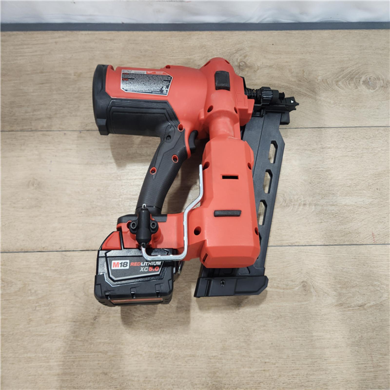 AS-IS- M18 FUEL 18-Volt Brushless Lithium-Ion Cordless 21-Degree Duplex Nailer Kit with 5Ah Battery and Charger